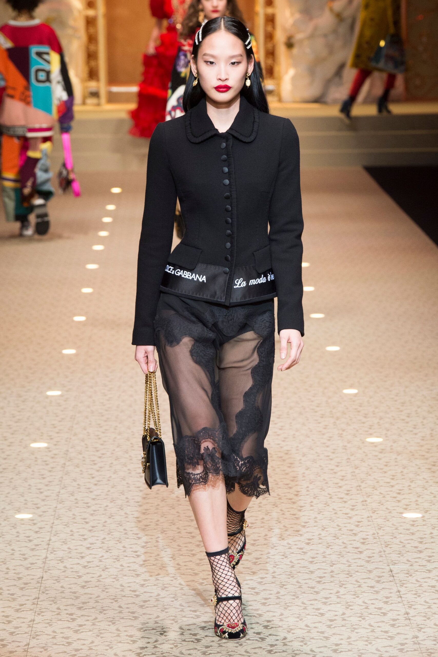 black fitted jacket and sheer midi skirt