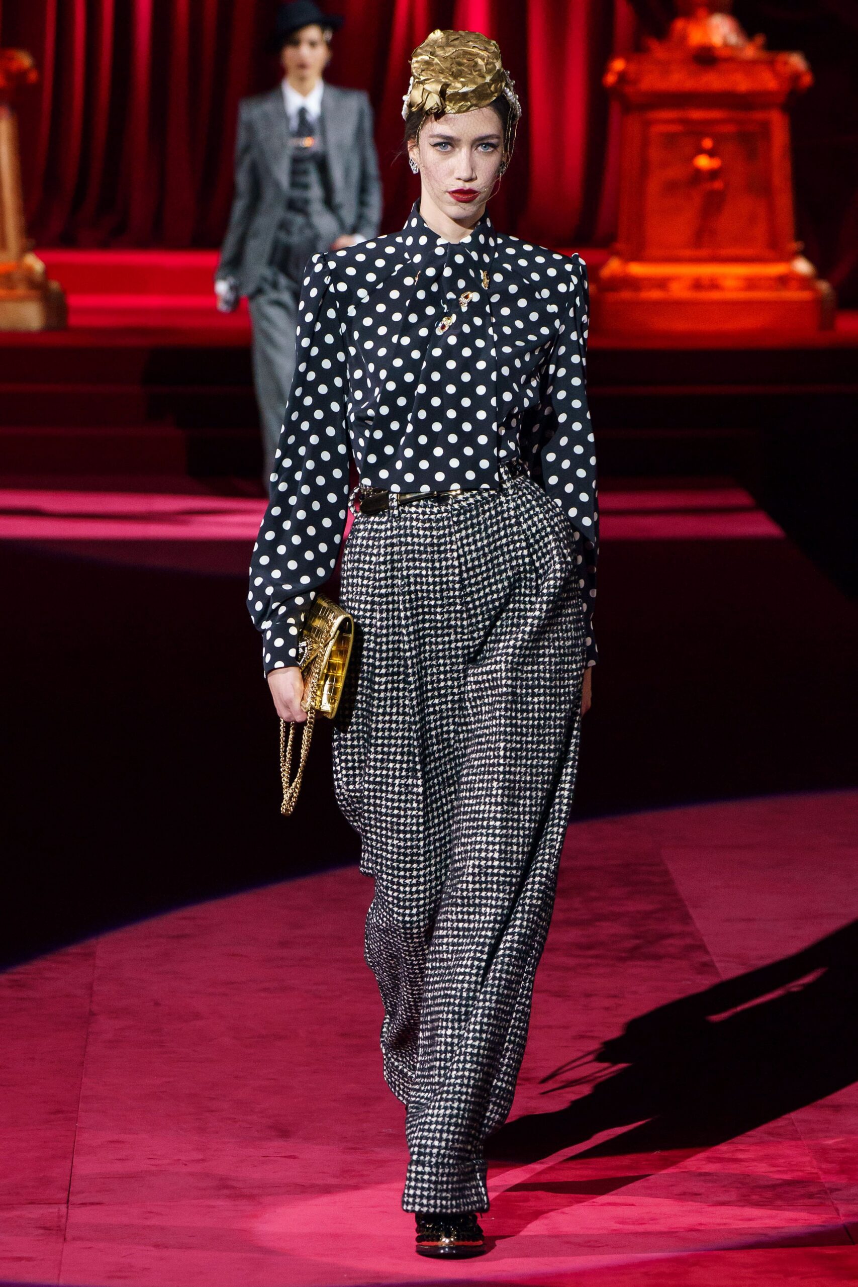 black and white polka-dot blouse with checked pants