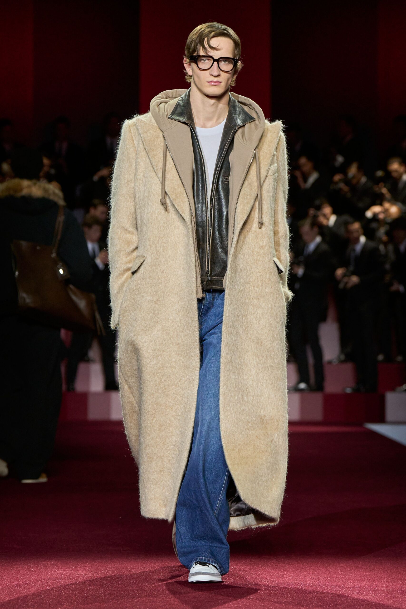 beige wool coat with black leather jacket