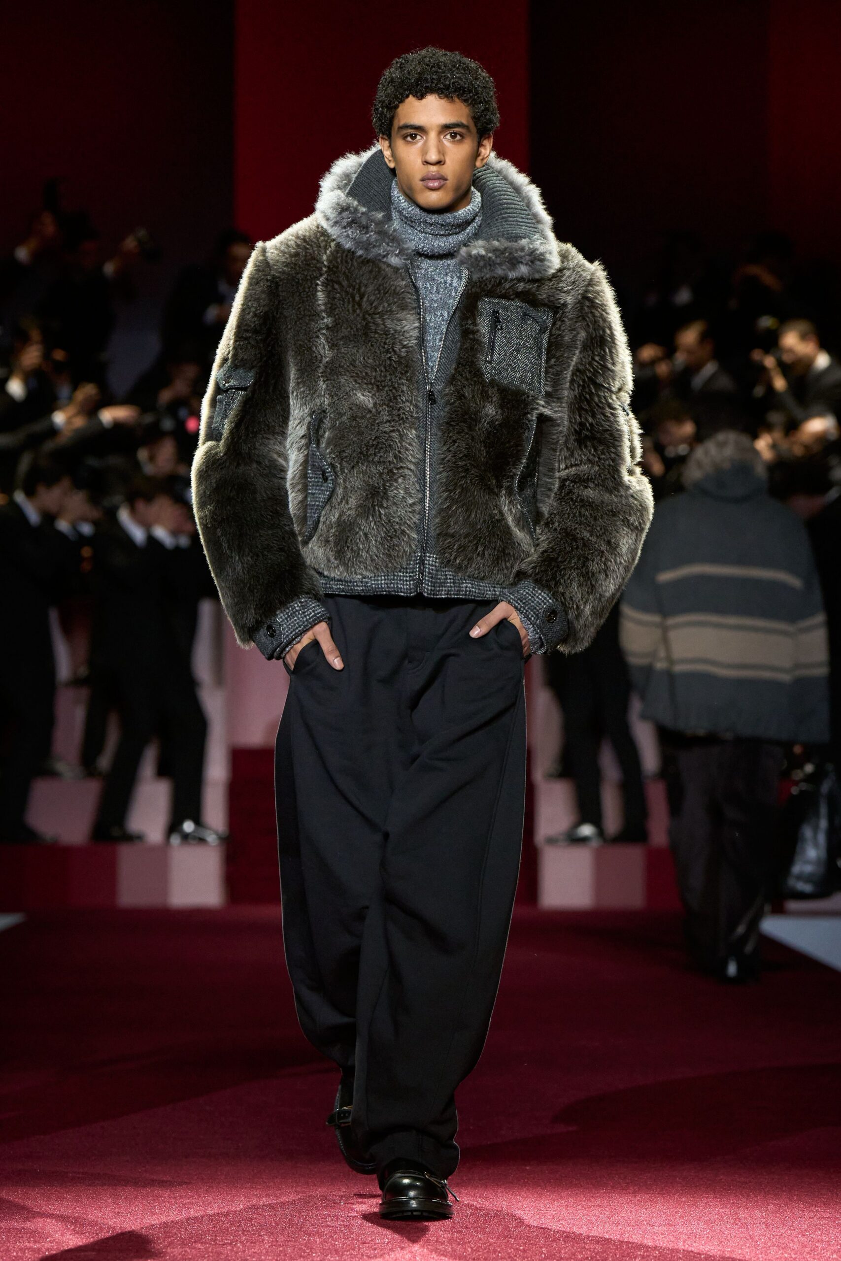 gray fur jacket with sweater and relaxed pants