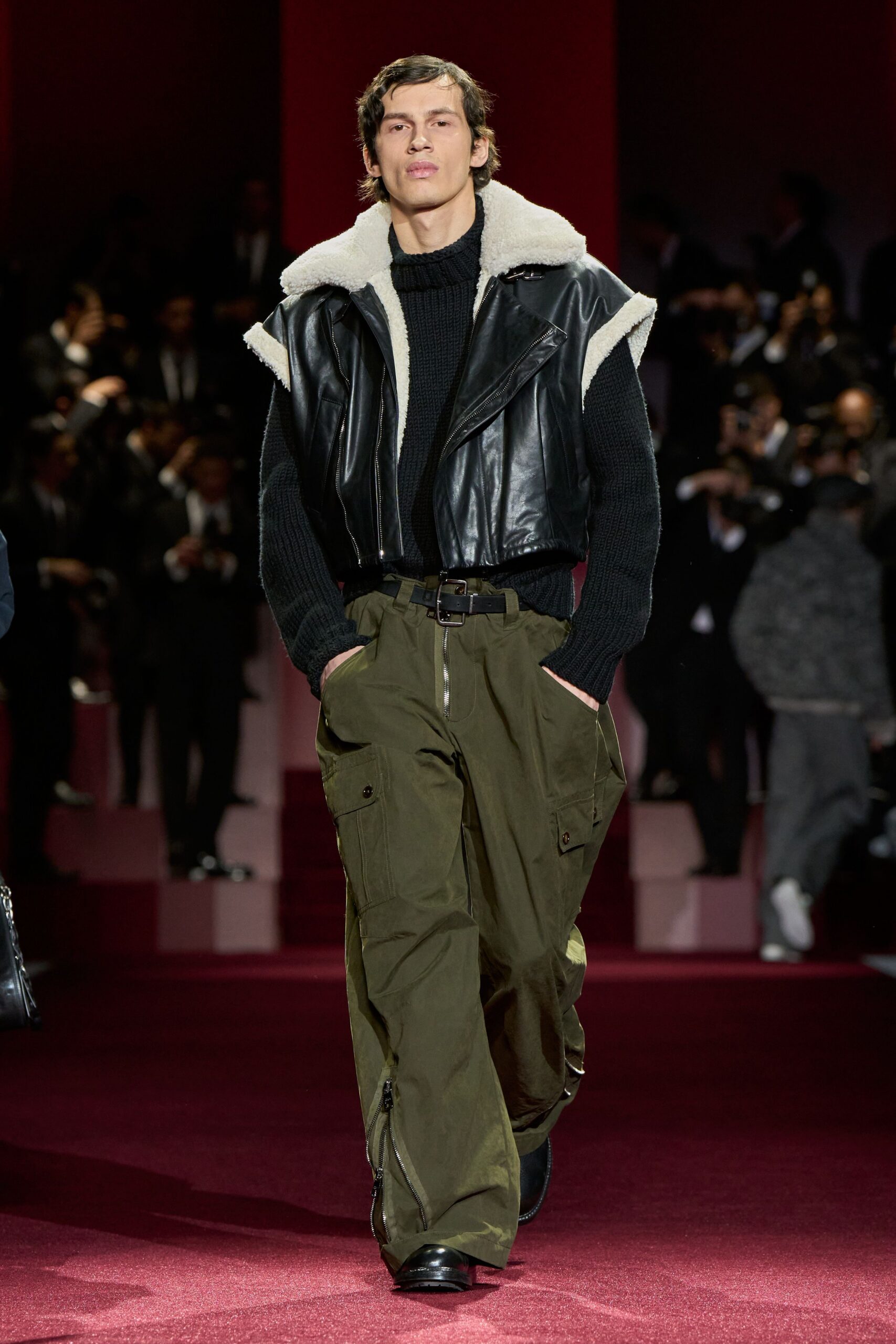 black leather jacket with sweater and cargo pants