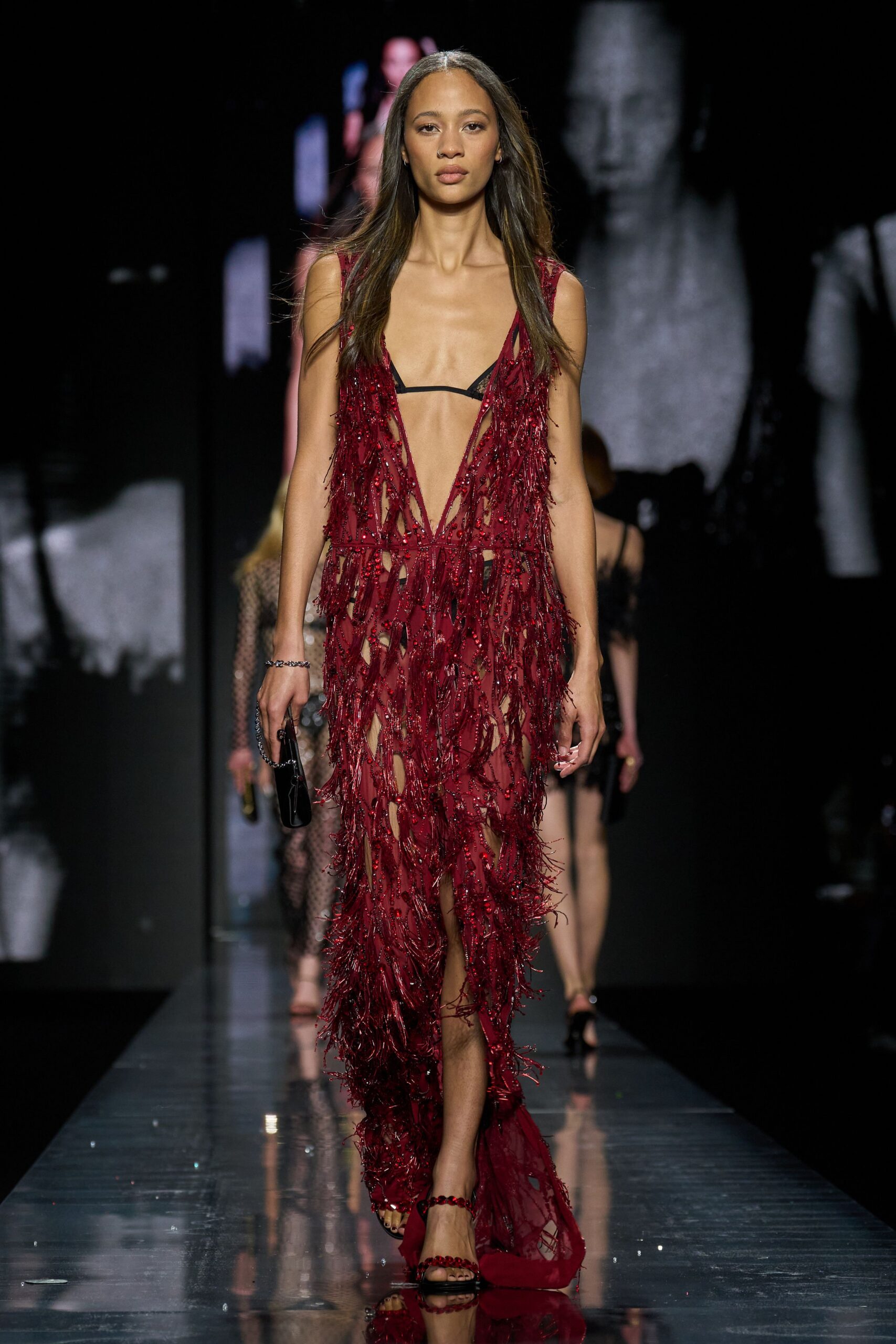 red silk sleeveless v-neck fitted fringed flowing gown