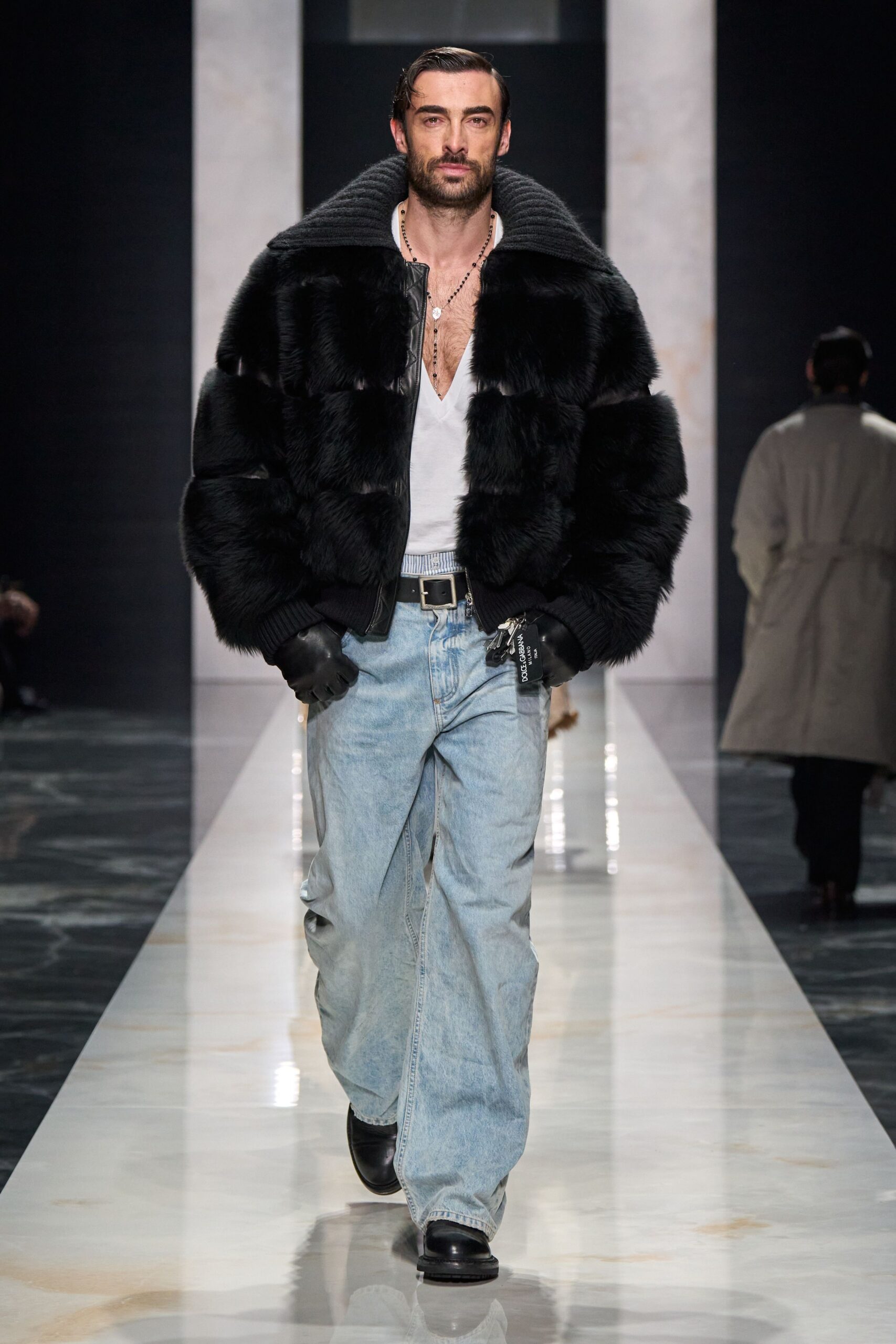 black faux-fur jacket with denim pants