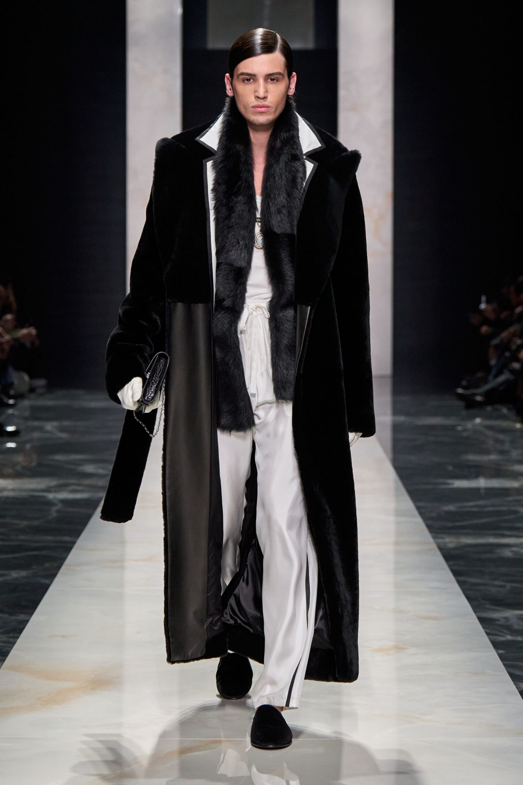 black faux-fur coat with white silk pants