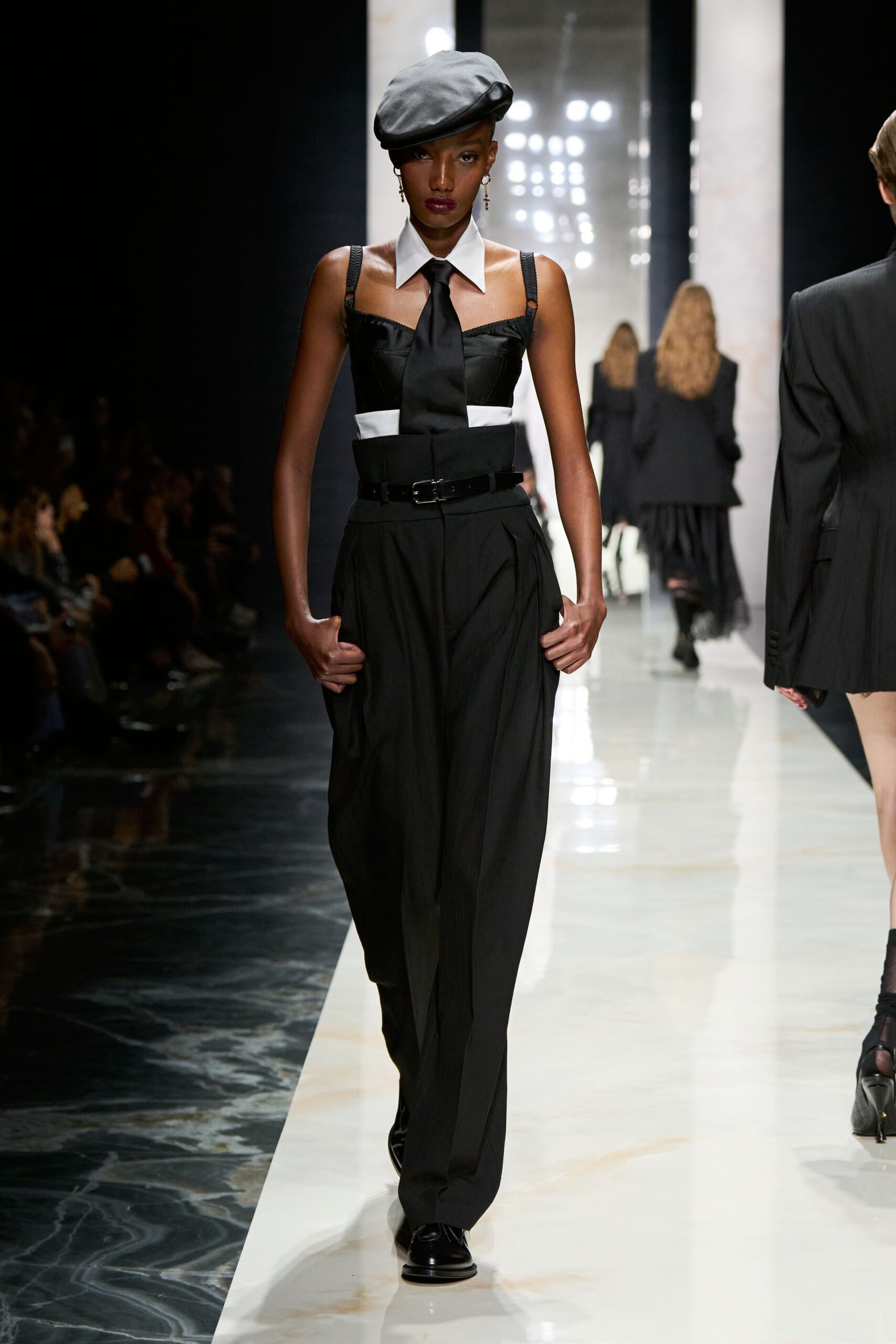 black sleeveless collared fitted buttoned top