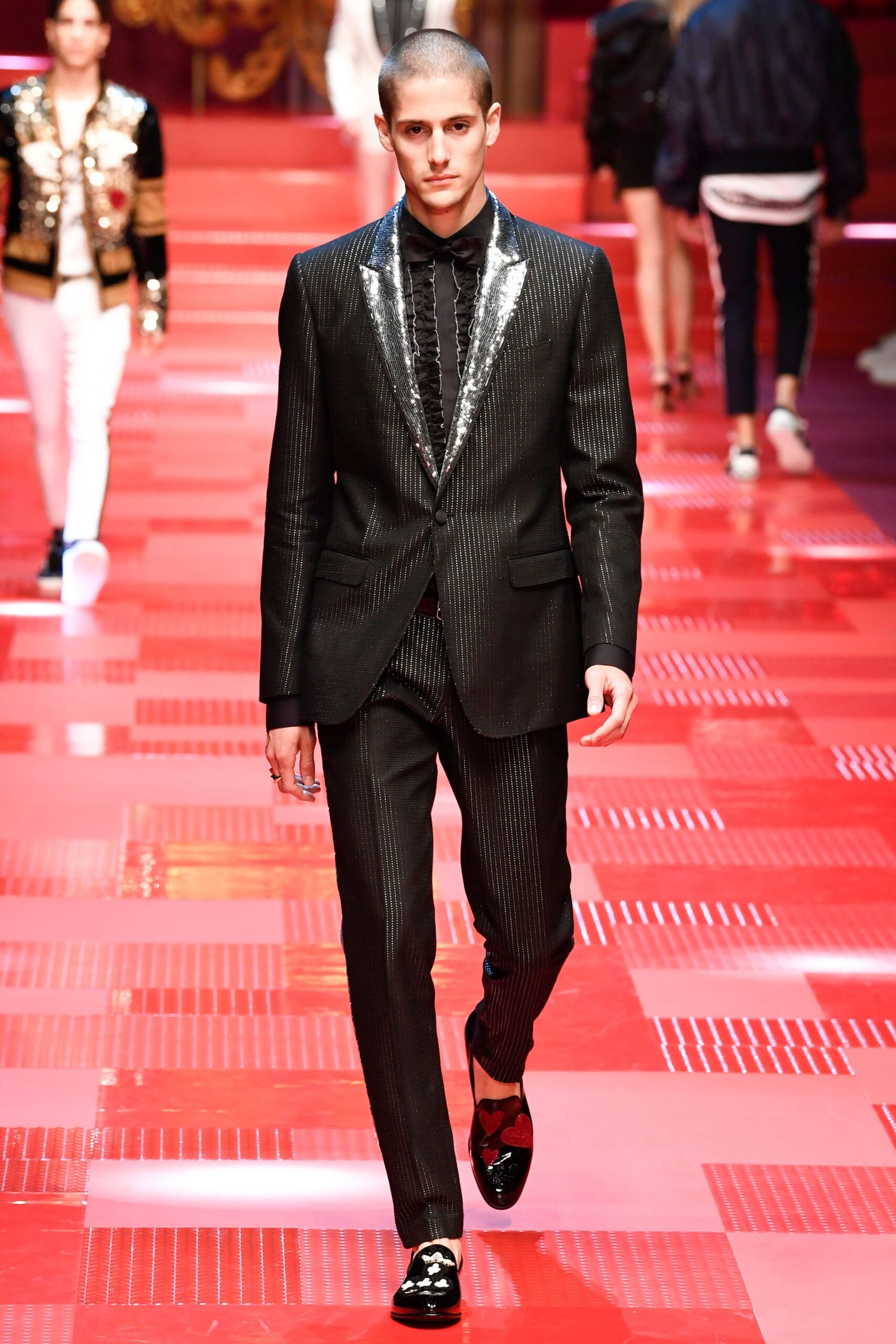 black tailored suit with shiny shoes