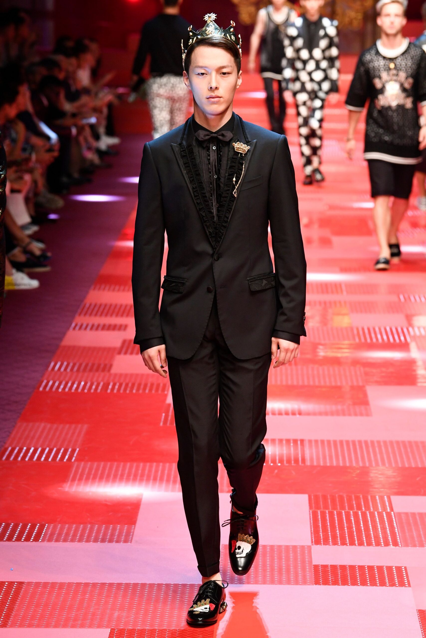 black fitted suit with crown
