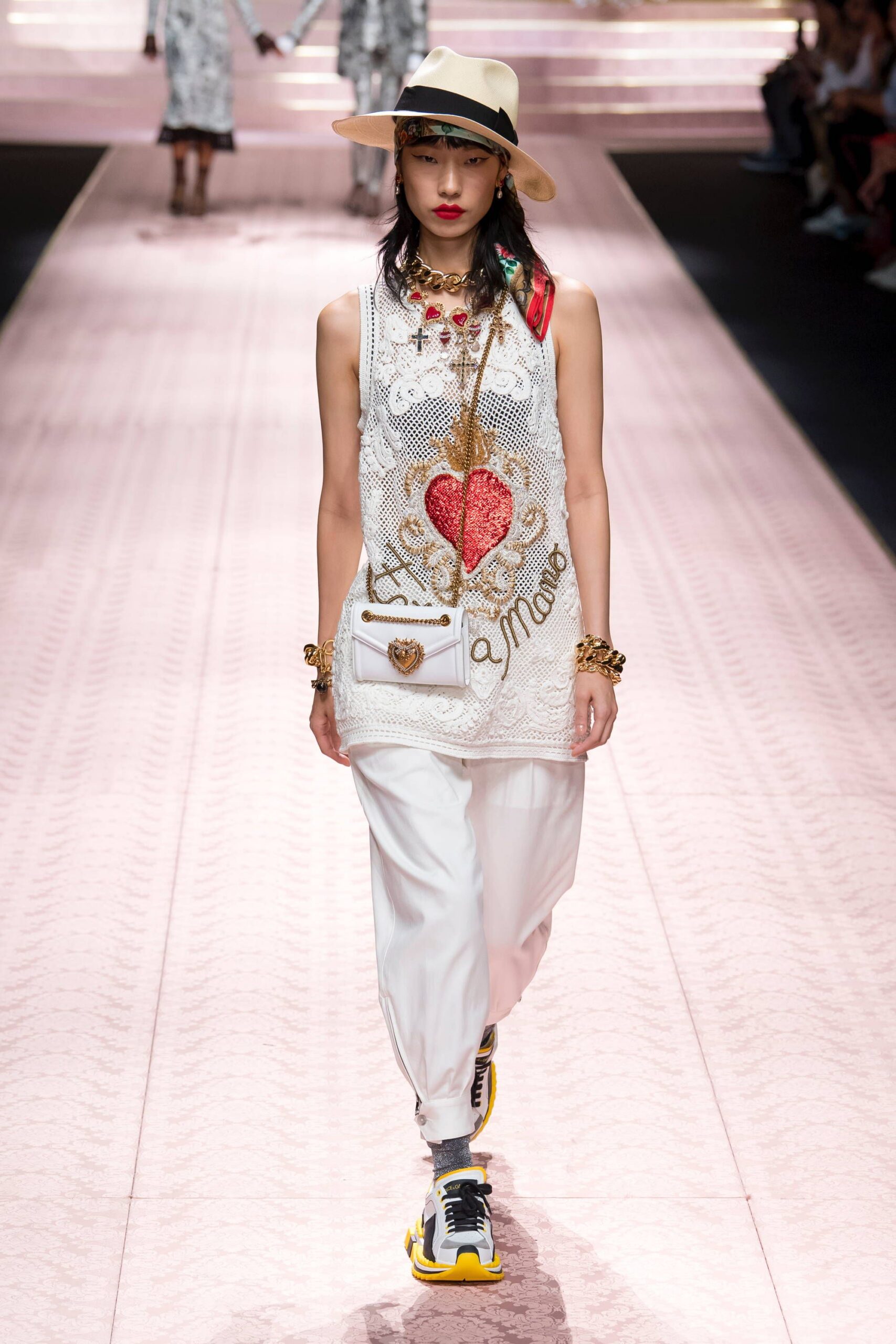 white embroidered sleeveless top with relaxed pants