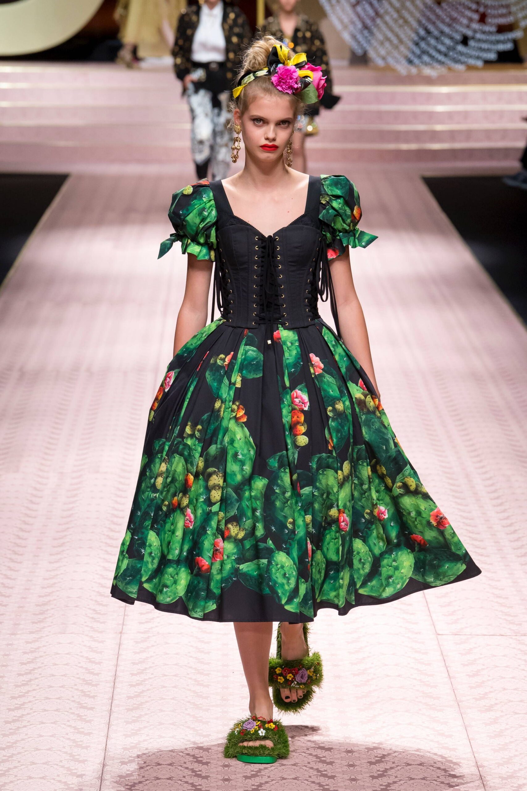 floral black and green midi dress with embellished shoes