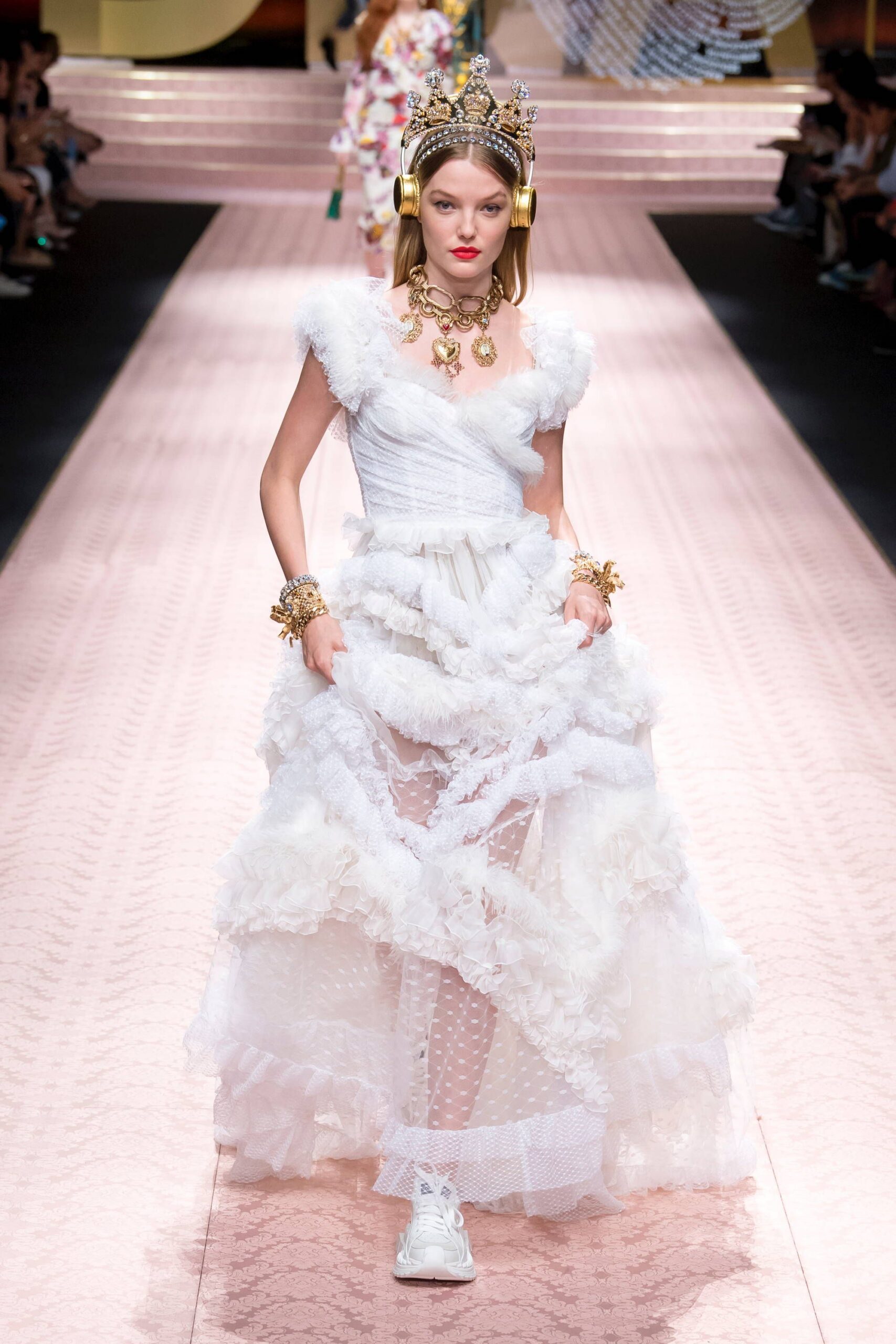white ruffled maxi gown with sneakers