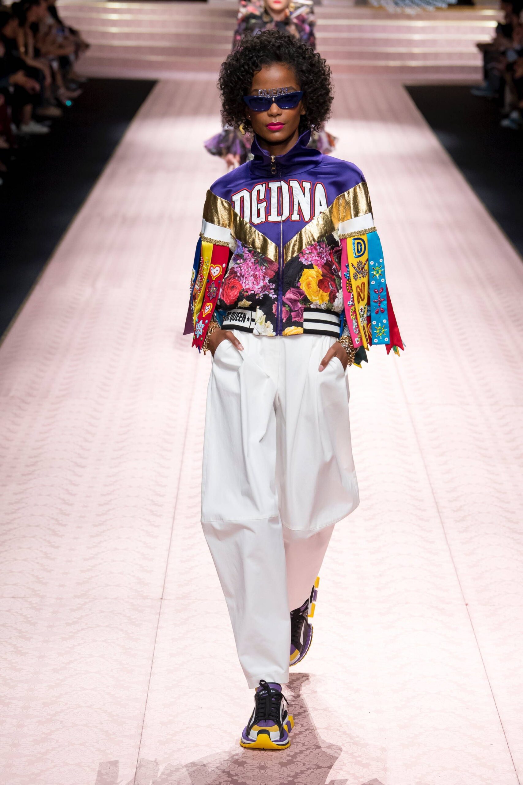 purple embroidered jacket with white pants