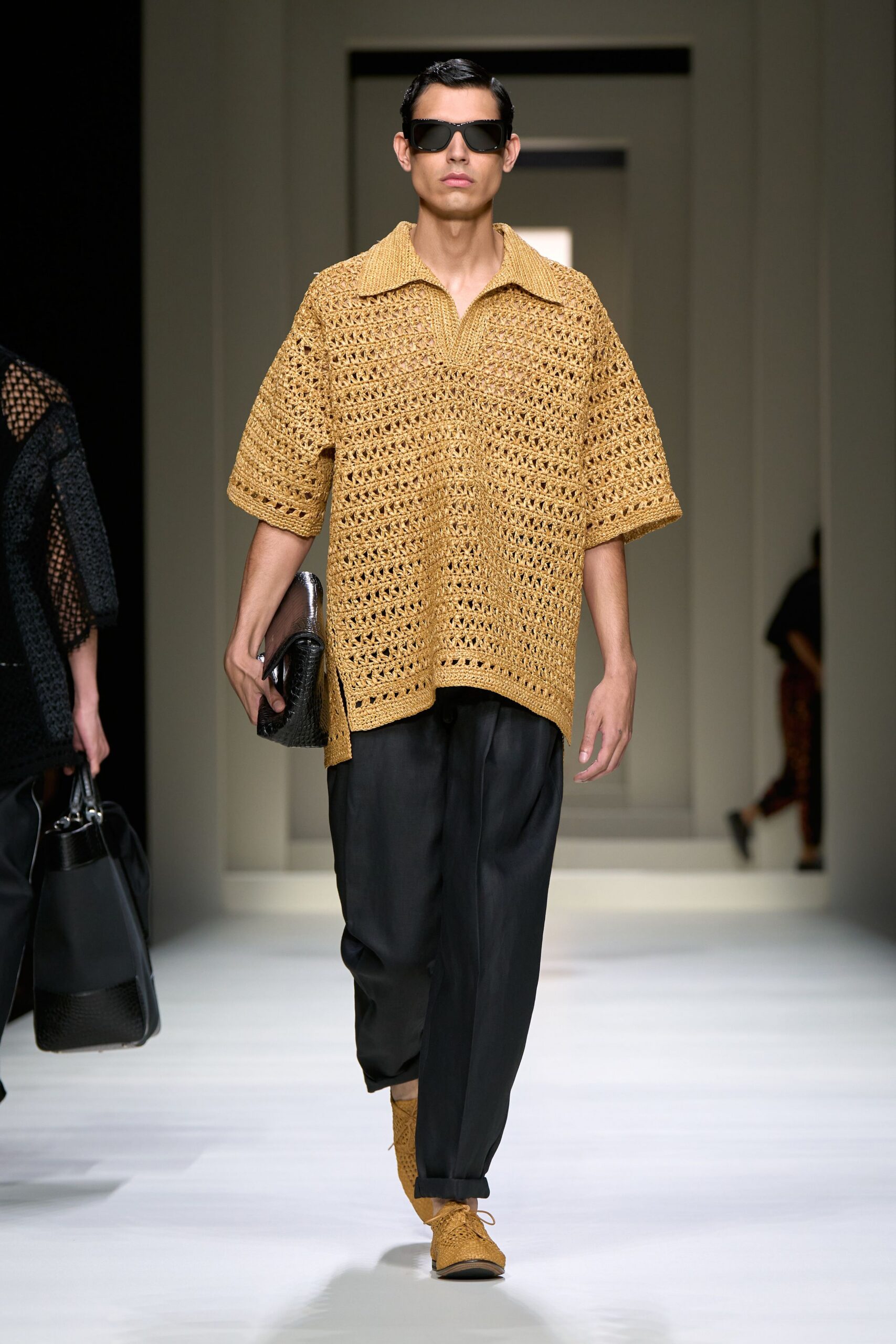 yellow crochet top with black pants