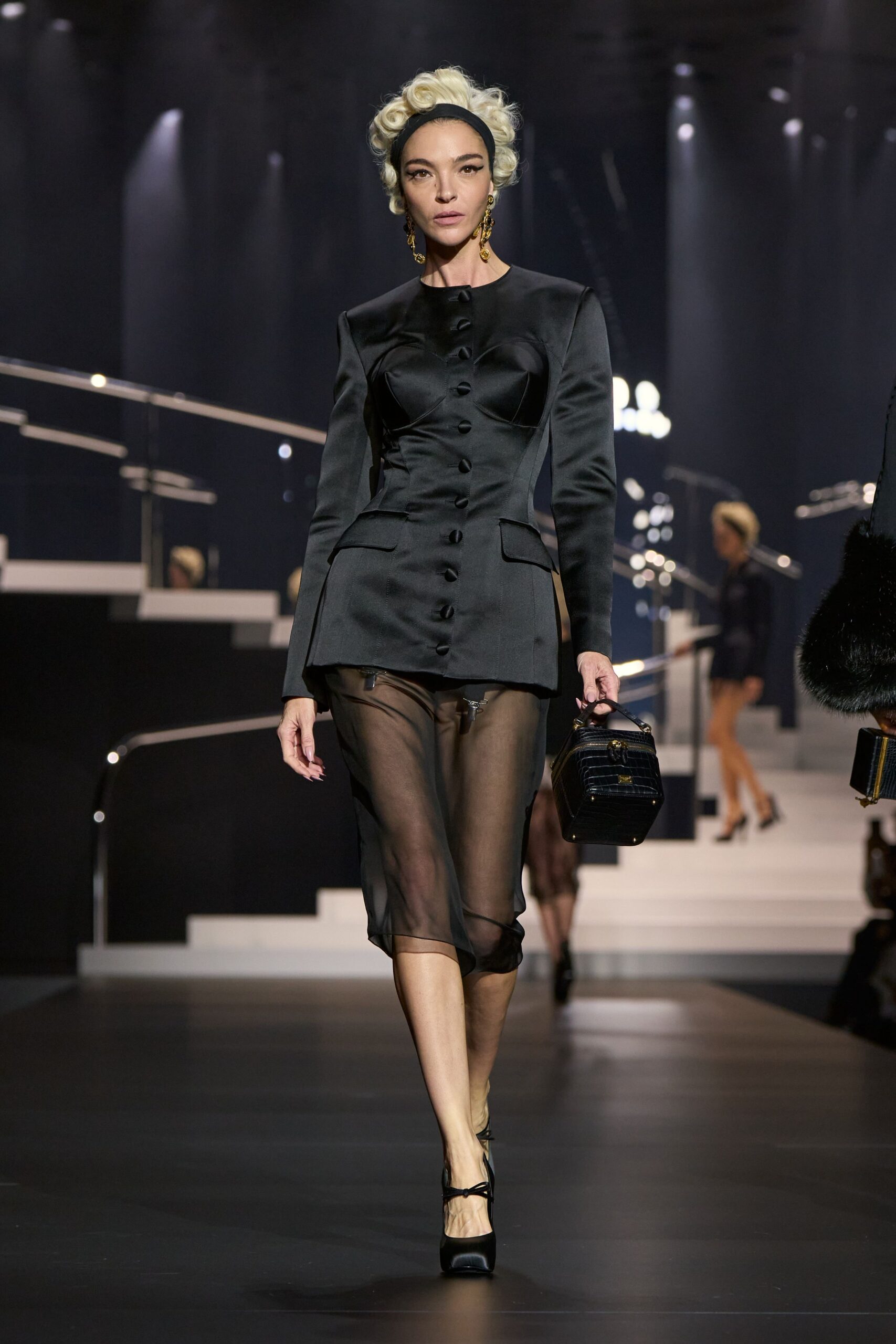 black fitted blazer and sheer skirt