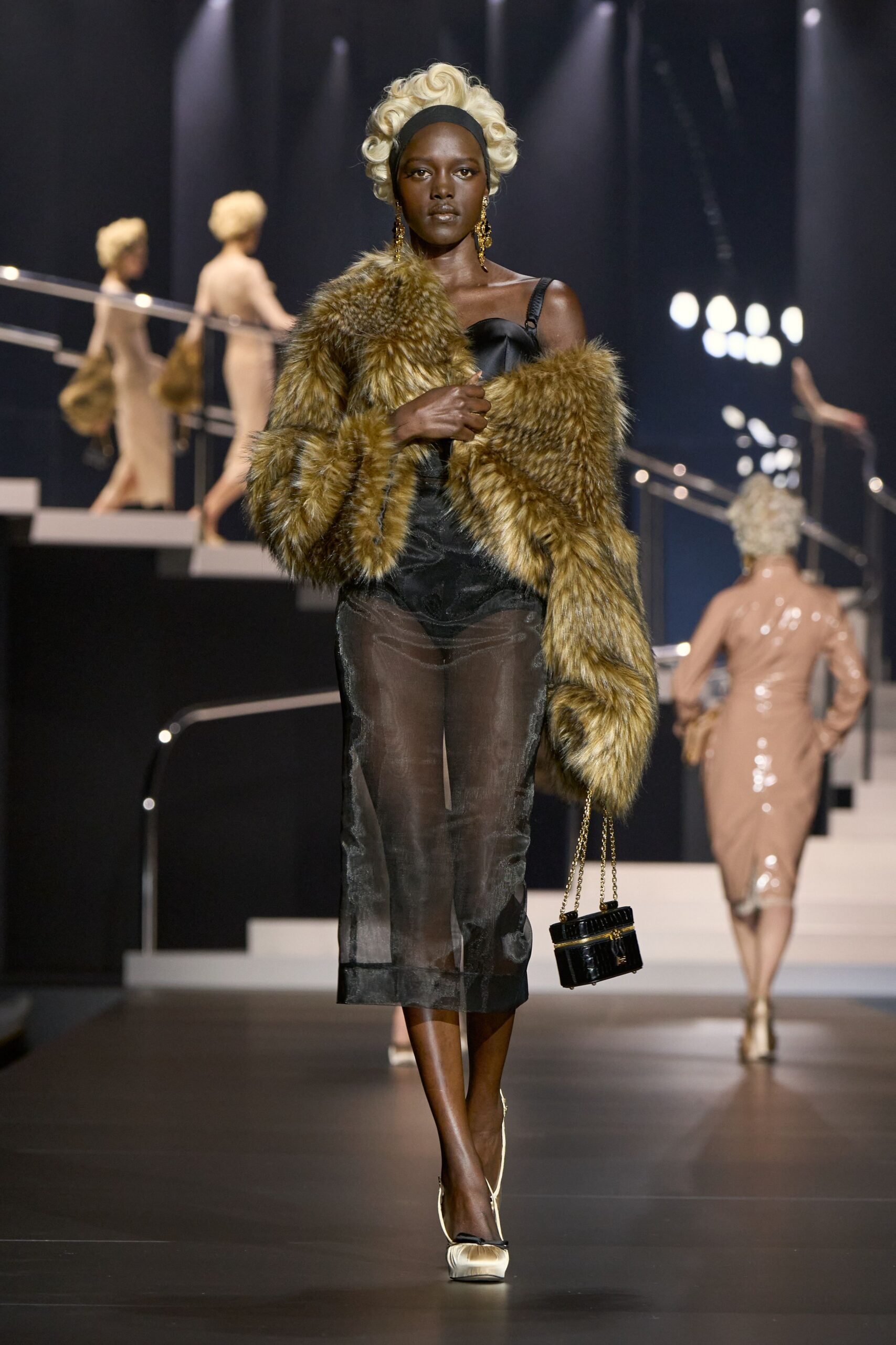 black silk sleeveless dress with brown faux-fur coat