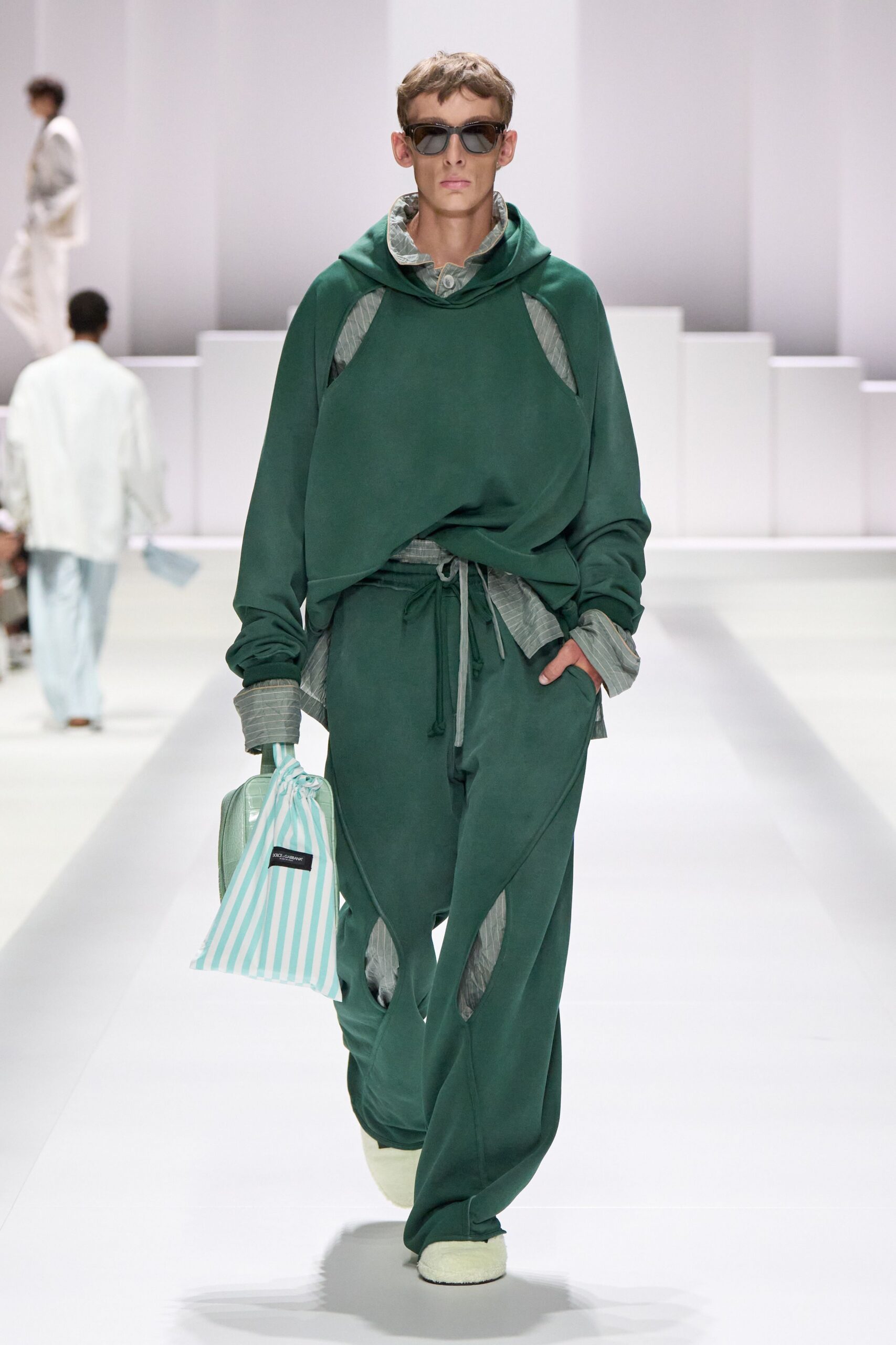 green hoodie and wide-leg pants