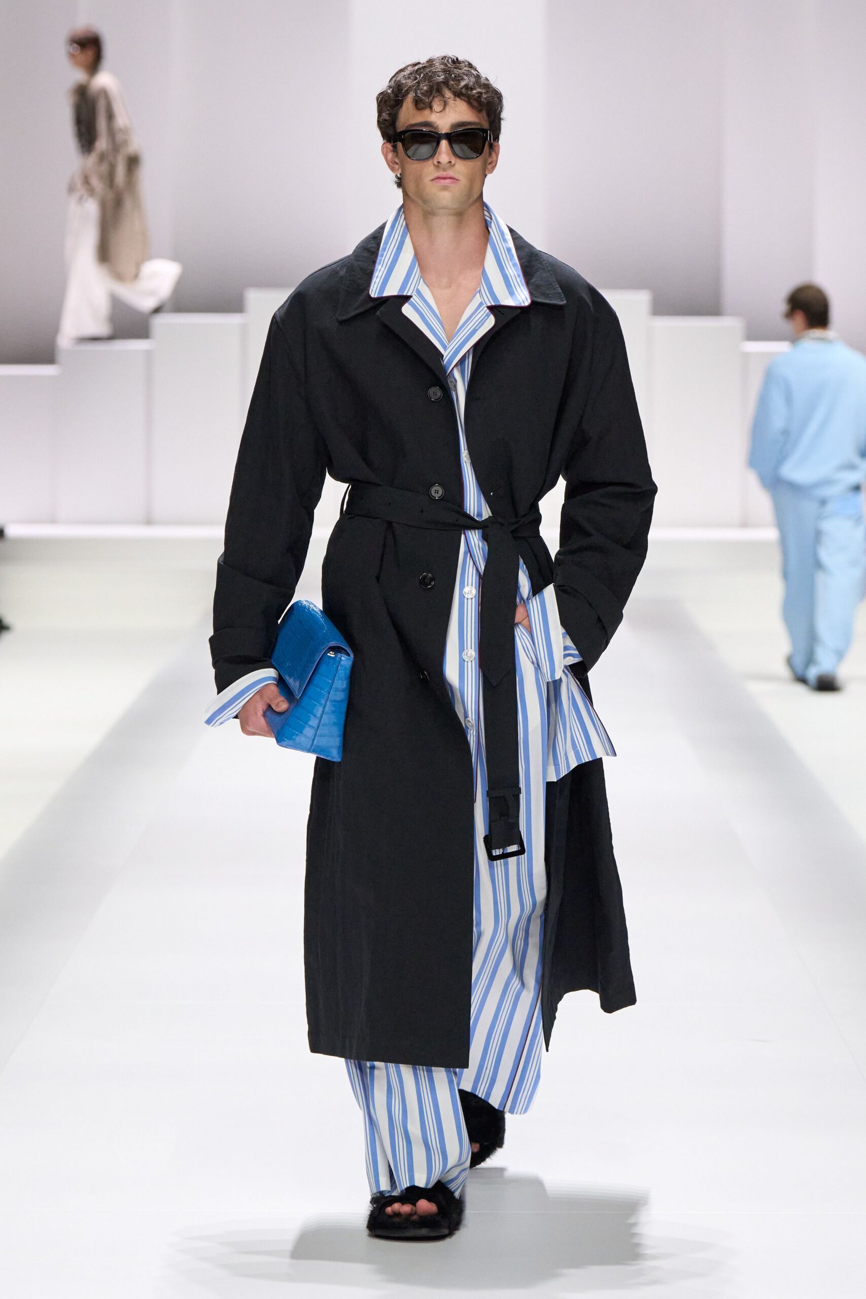black long-sleeve collared structured belted trench