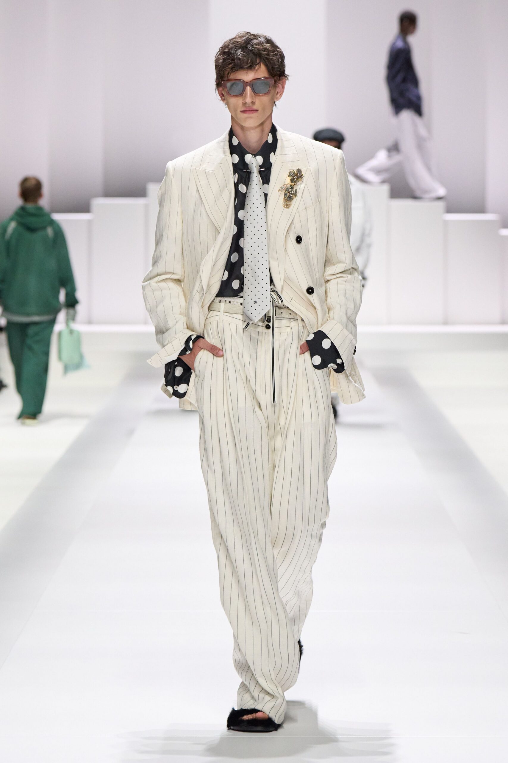 tailored striped suit with polka-dot shirt