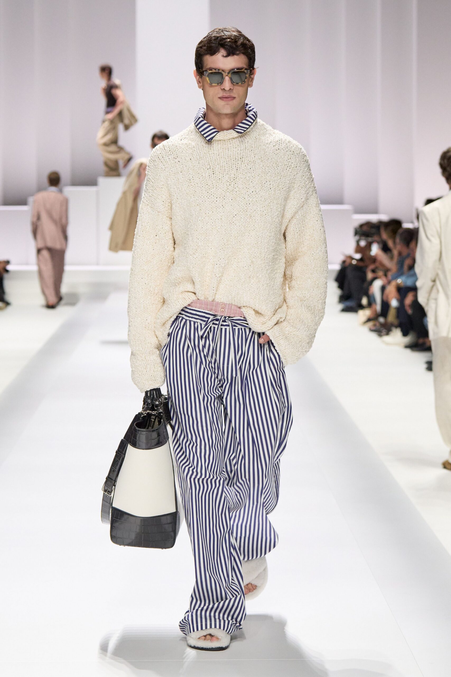 white knit sweater with striped pants