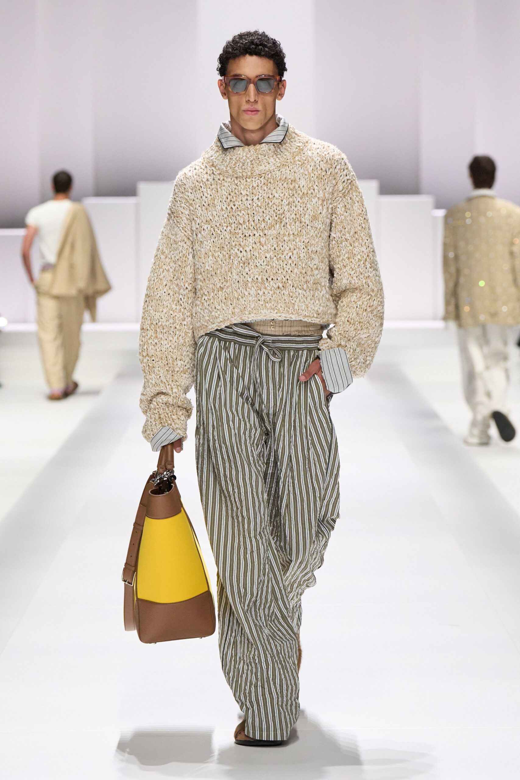 beige relaxed sweater with striped pants