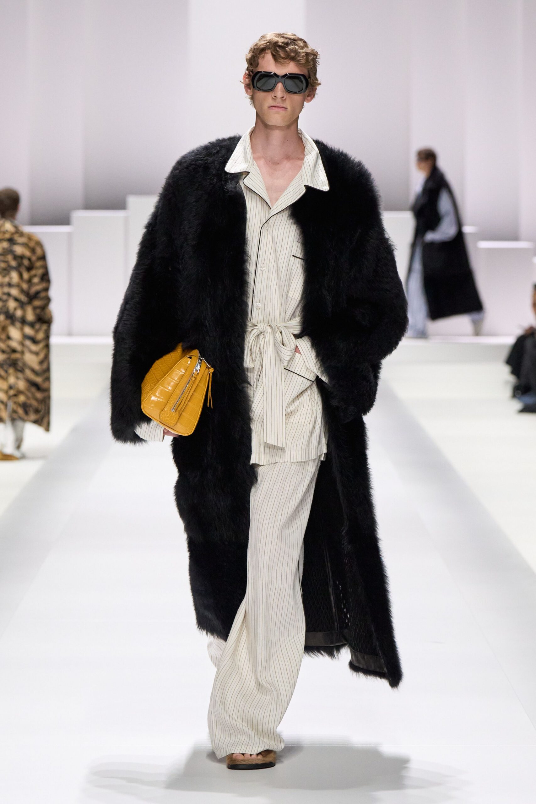 black faux-fur coat with striped shirt