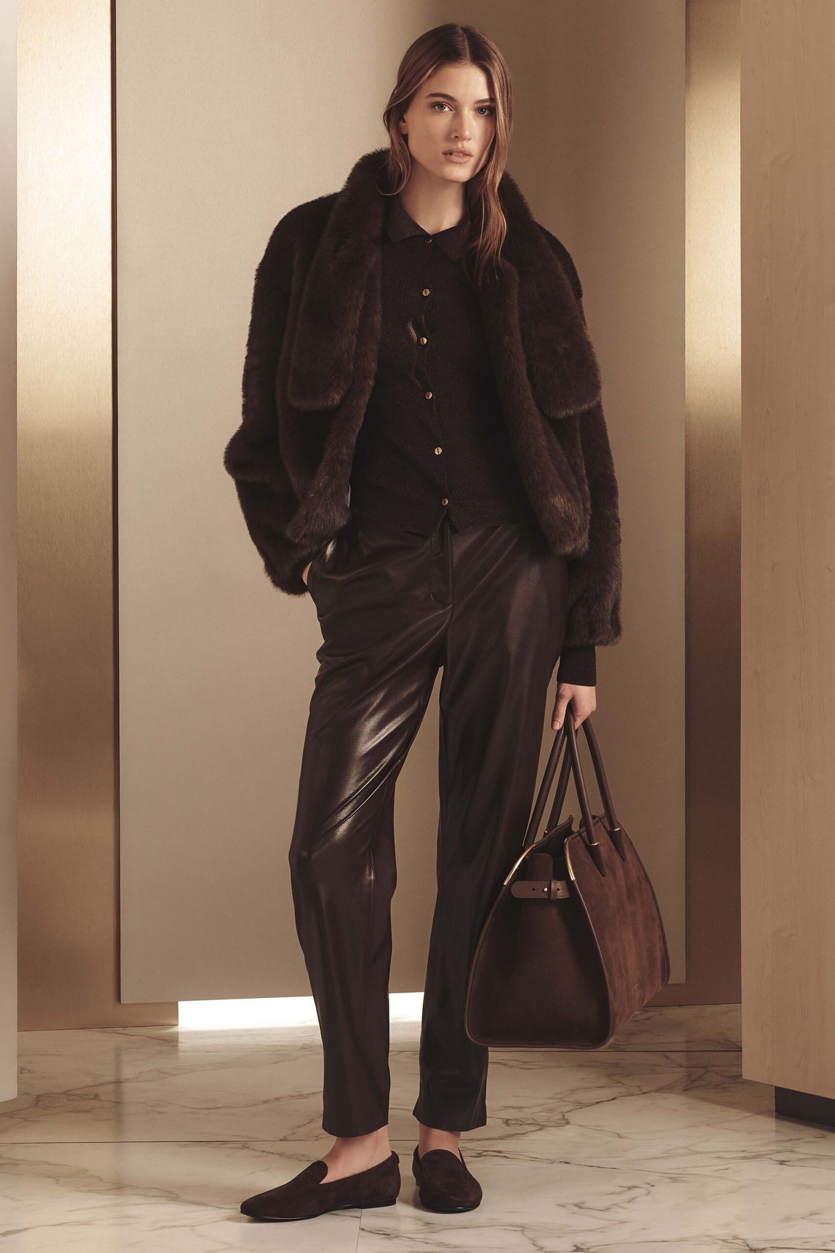 brown fur jacket with black blouse