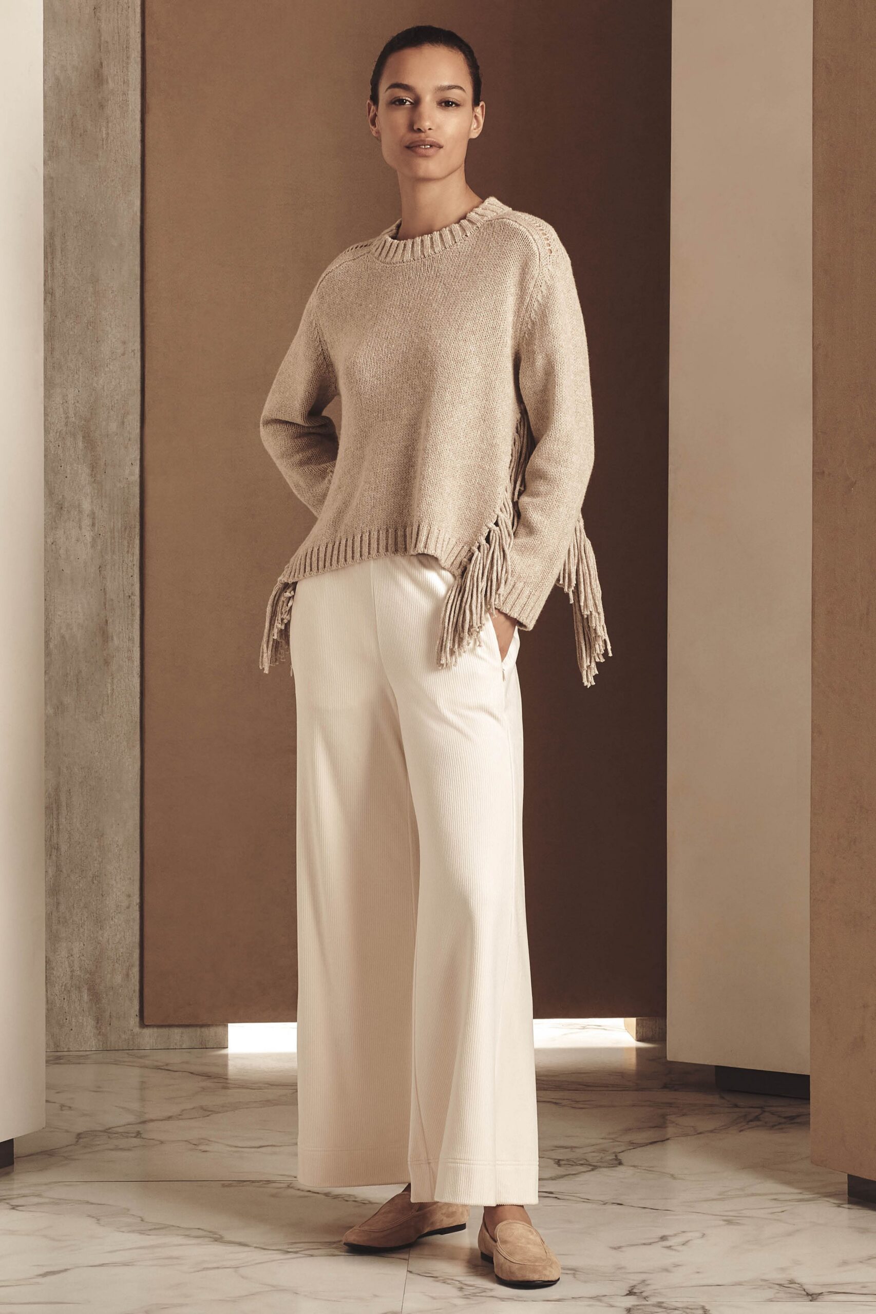 beige relaxed sweater with fringes