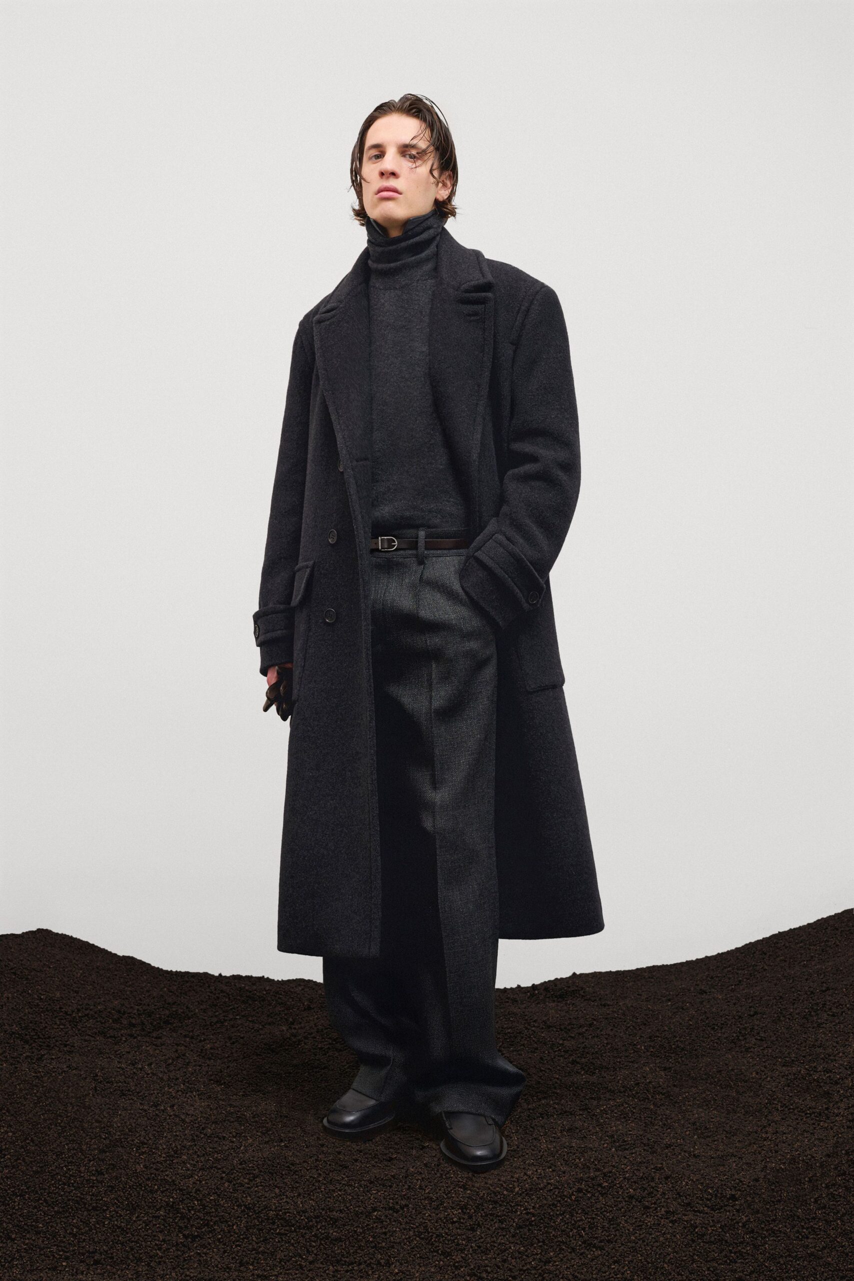 black wool long-sleeve collared structured buttoned coat