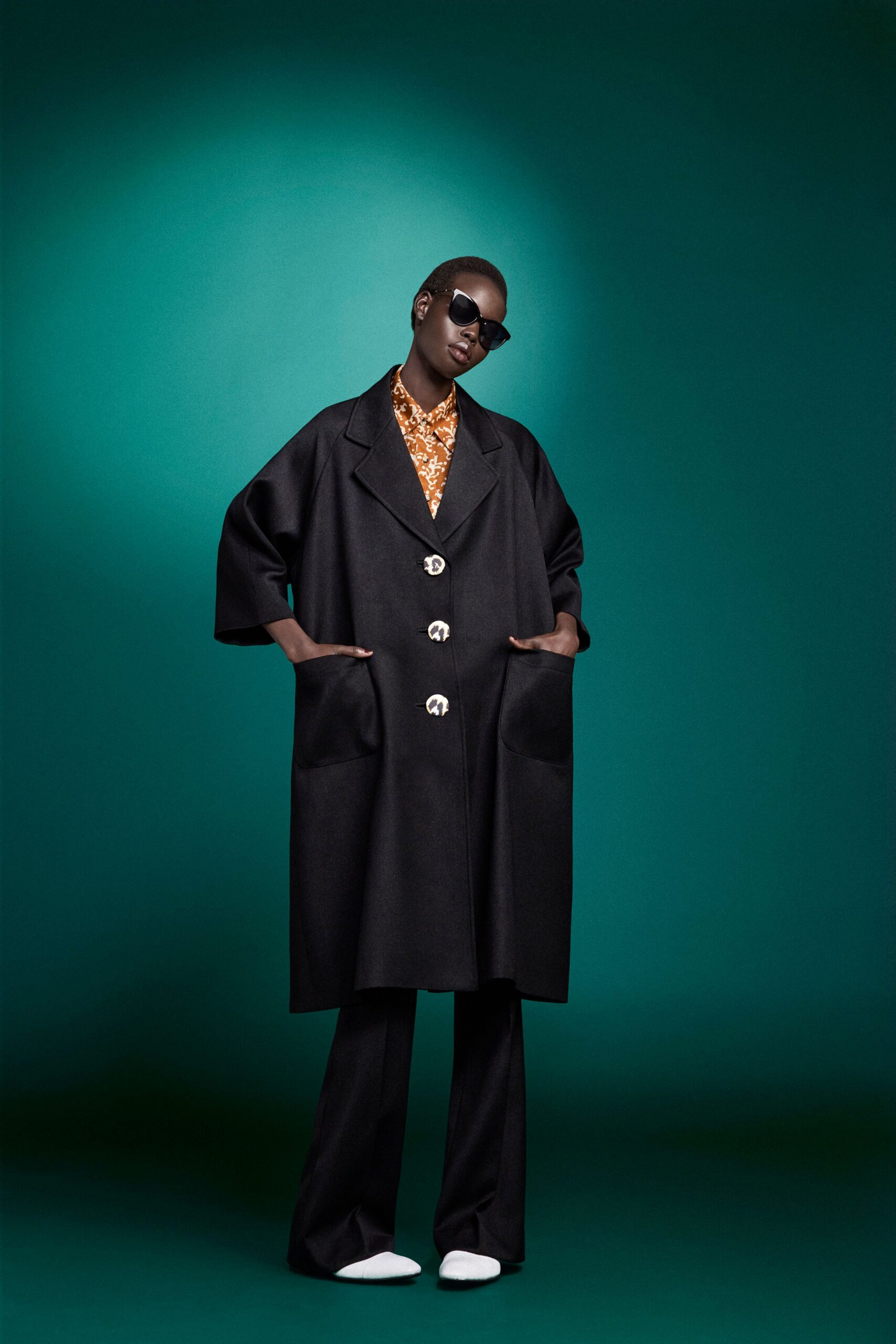 black wool long-sleeve collared oversized buttoned pockets coat