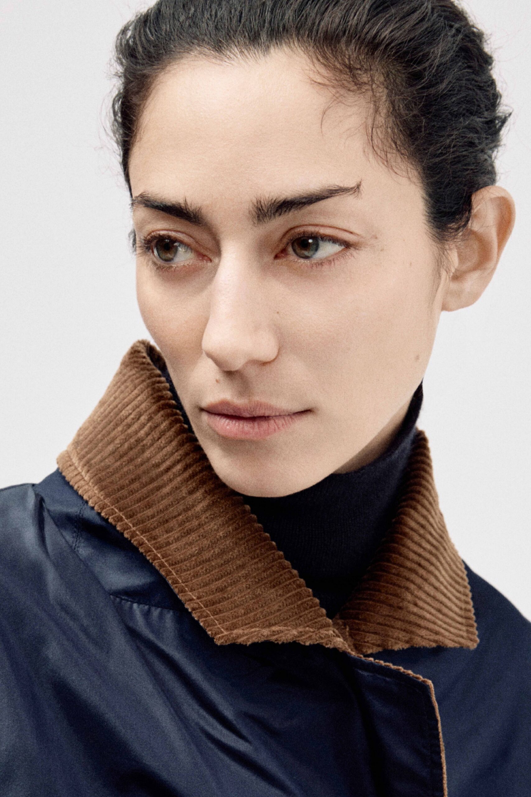 blue jacket with brown collar