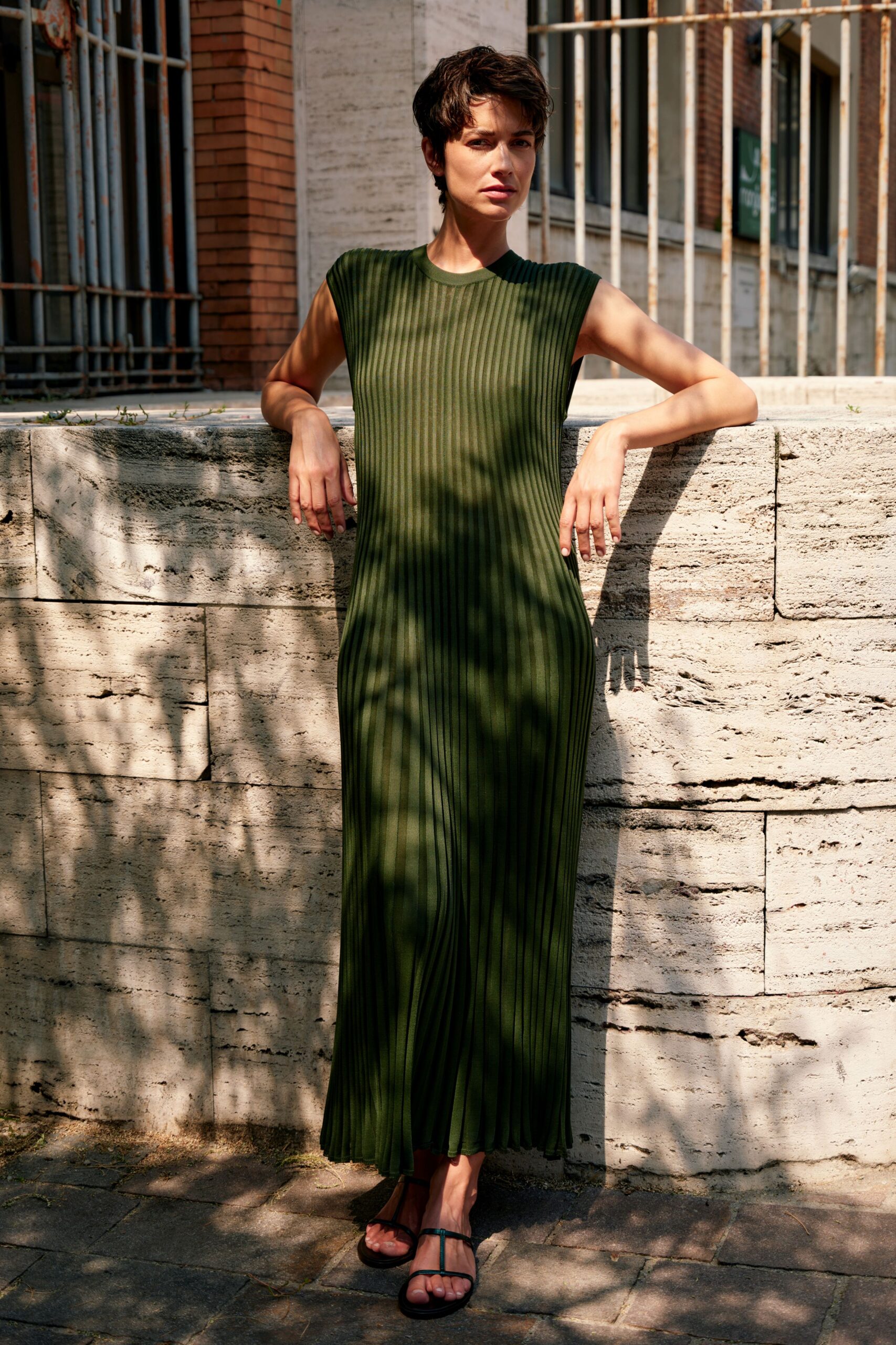 green cotton sleeveless high-neck fitted pleated maxi dress