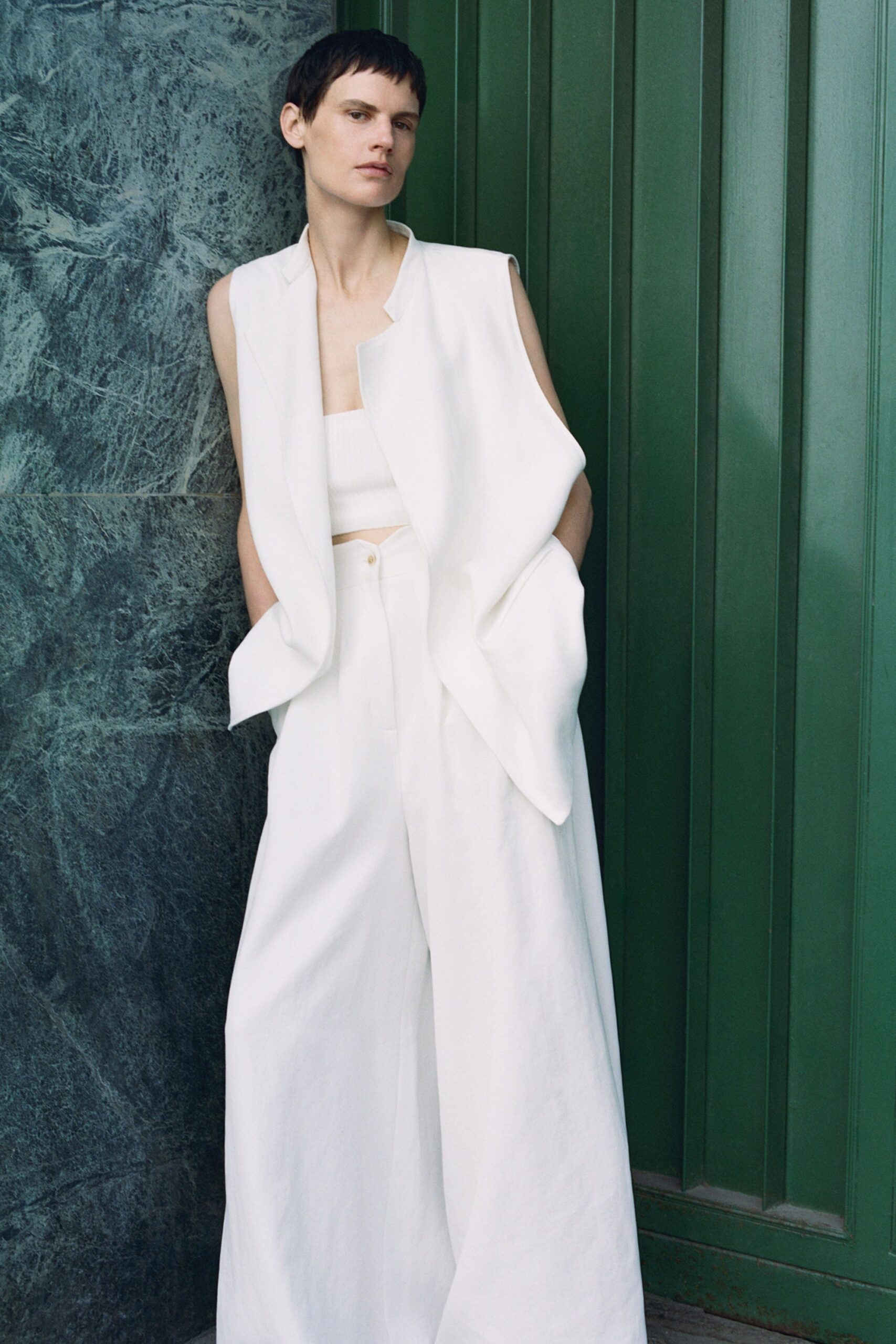 white cotton sleeveless collared relaxed layered vest