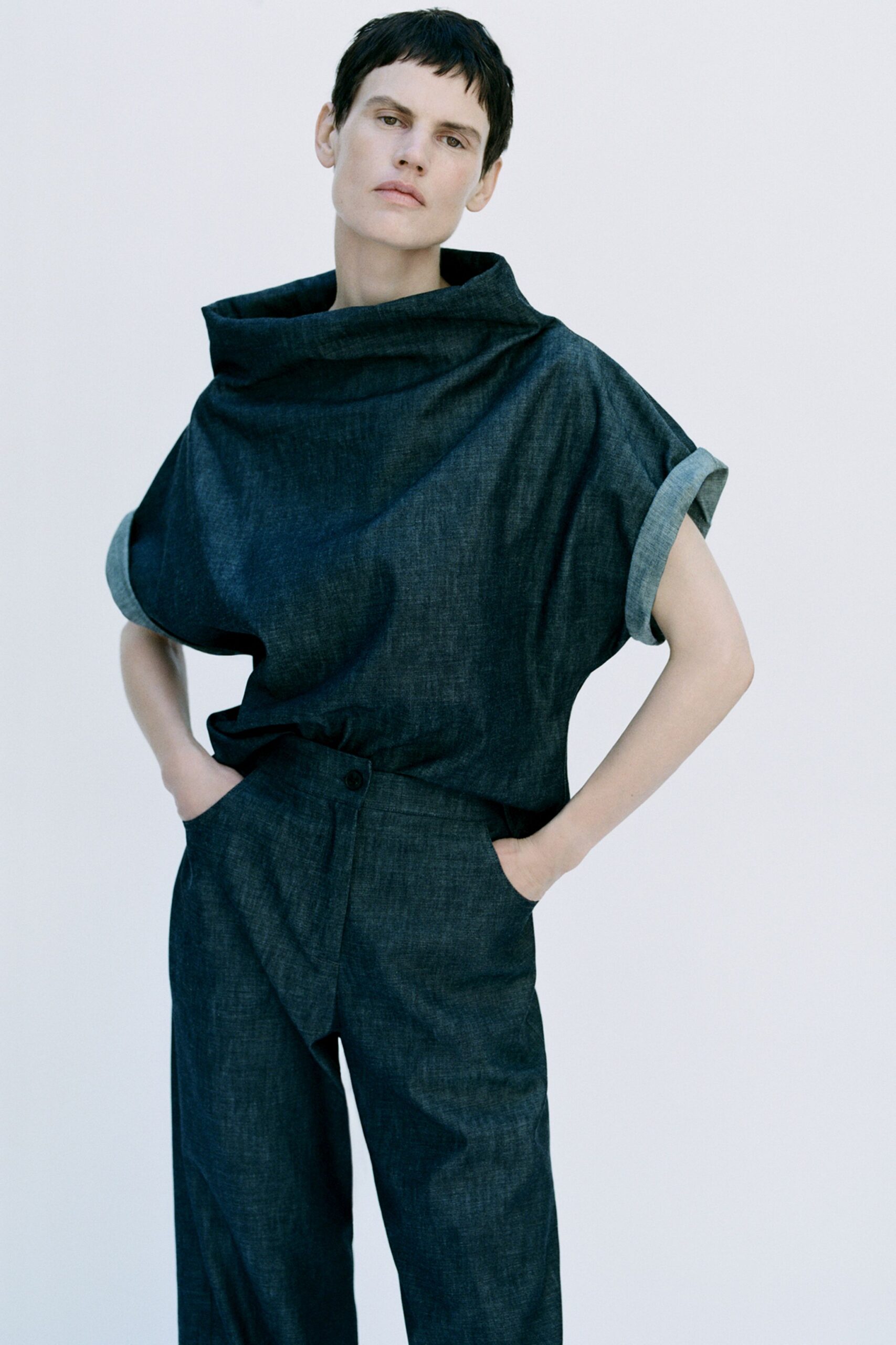 blue denim short-sleeve high-neck relaxed draped top