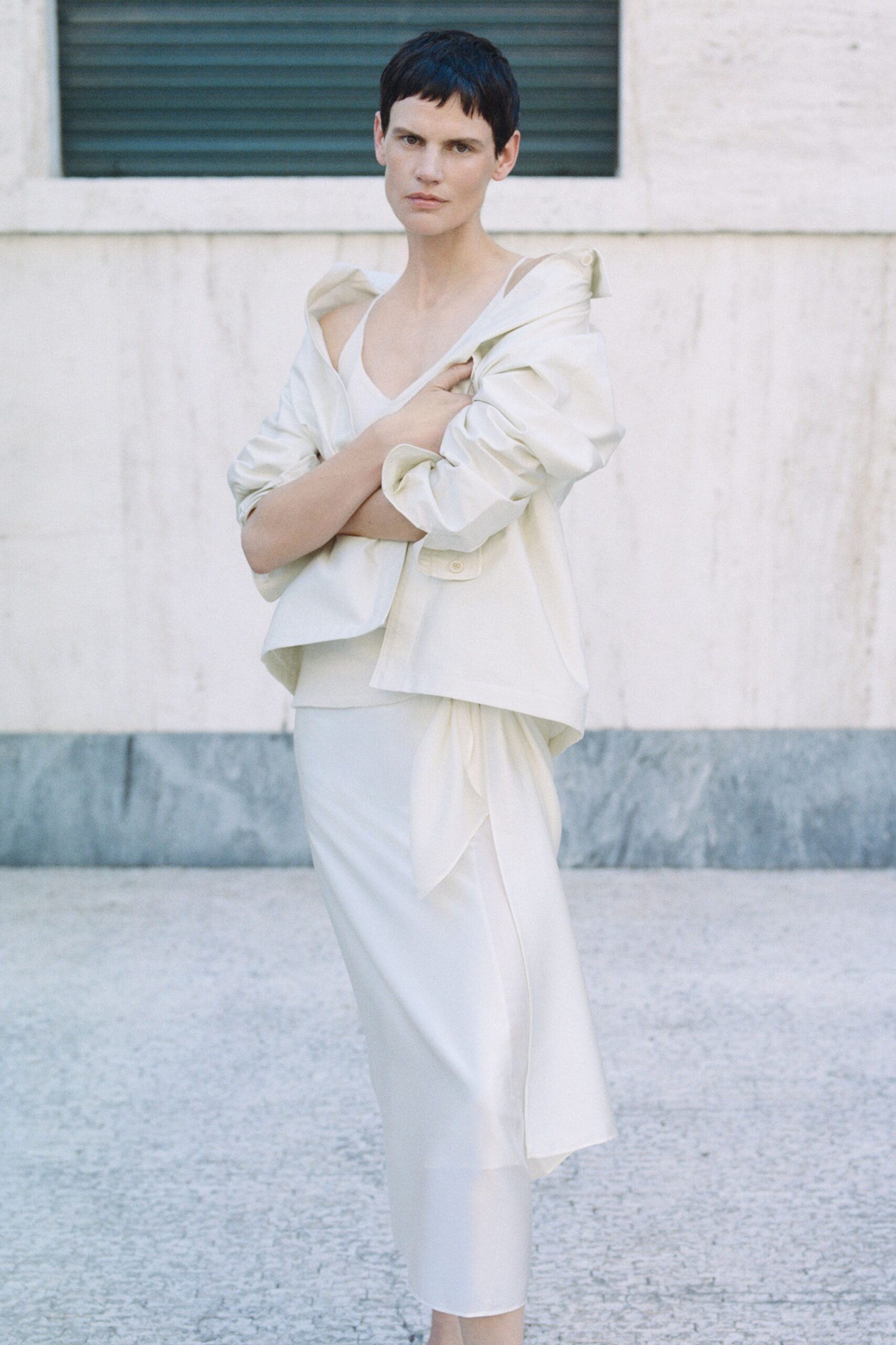 white relaxed jacket and fitted dress