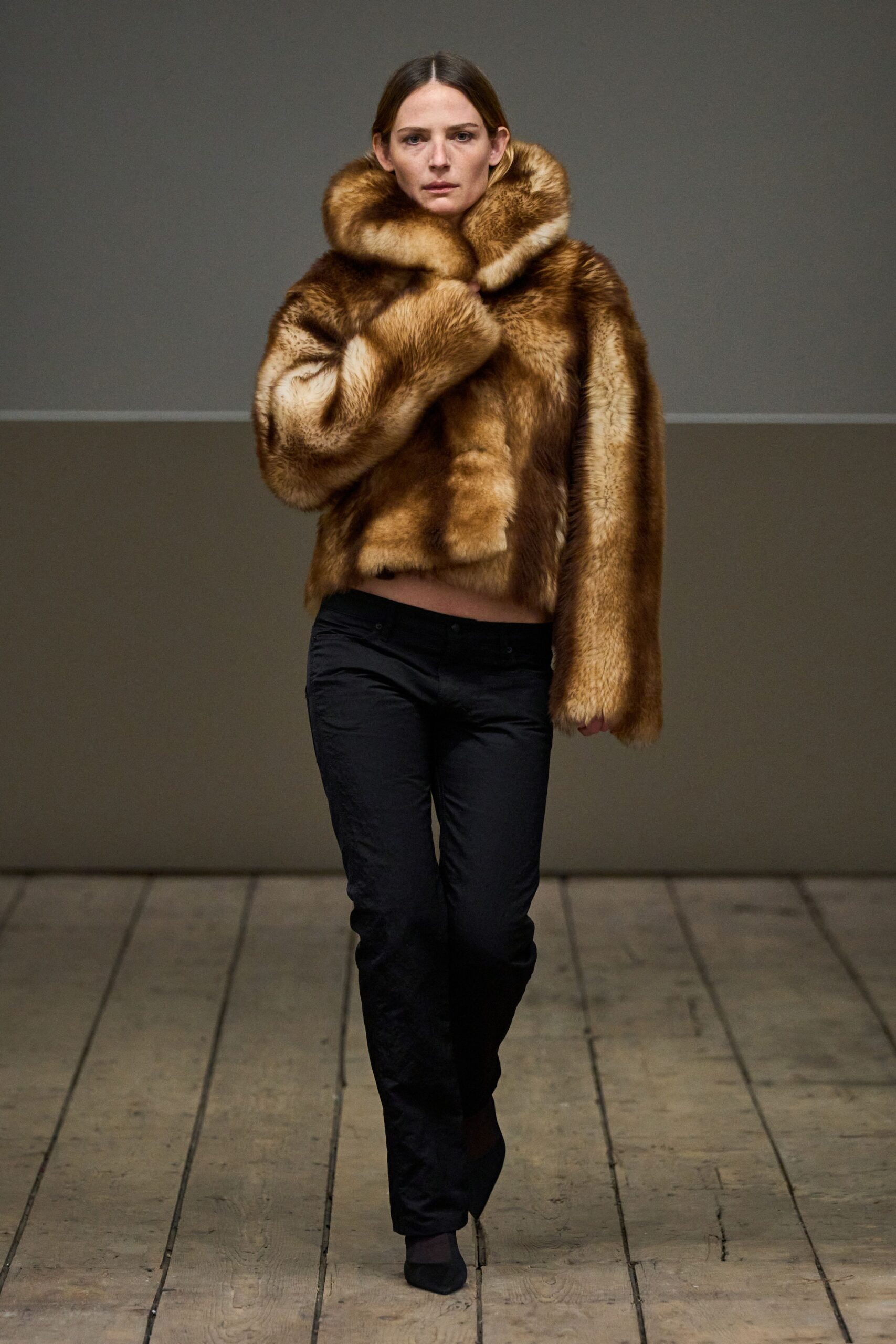 brown fur coat with black pants