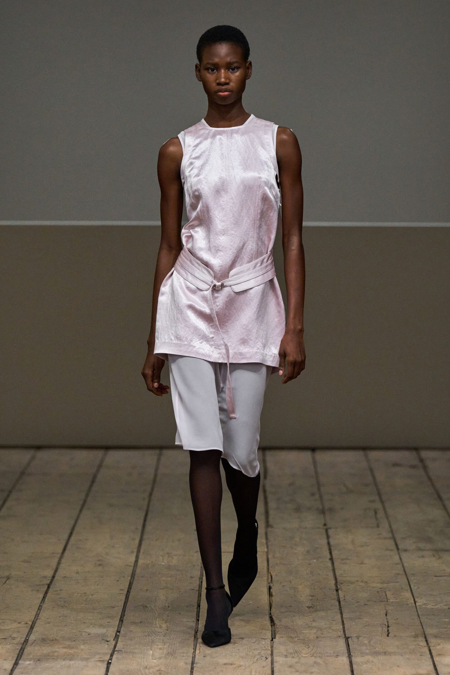 pink silk sleeveless high-neck fitted belted shiny top