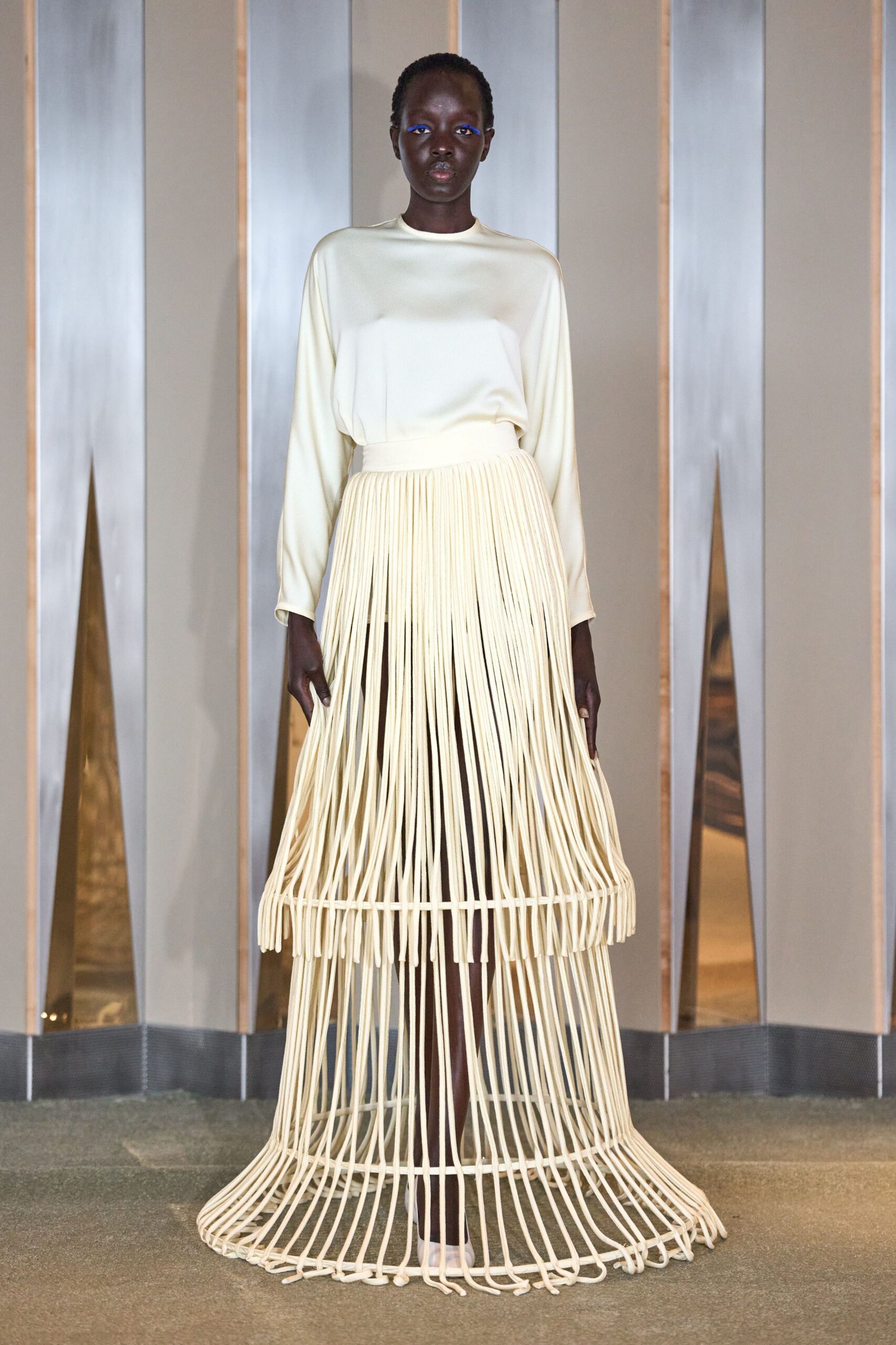 white silk top beige pleated skirt