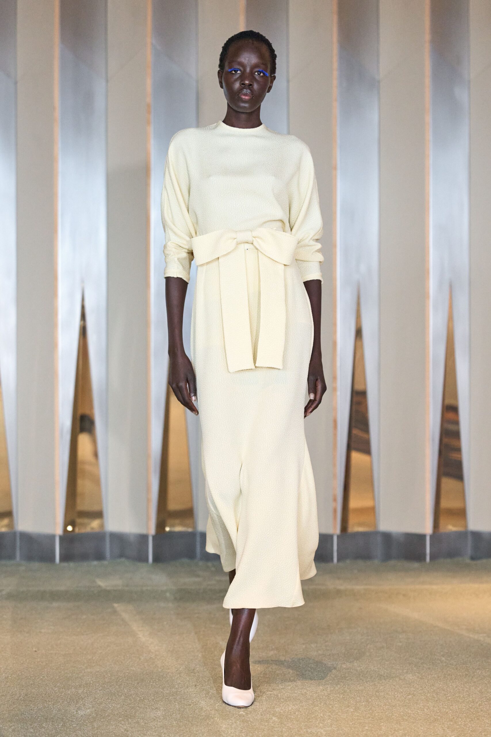 beige belted maxi dress with white shoes