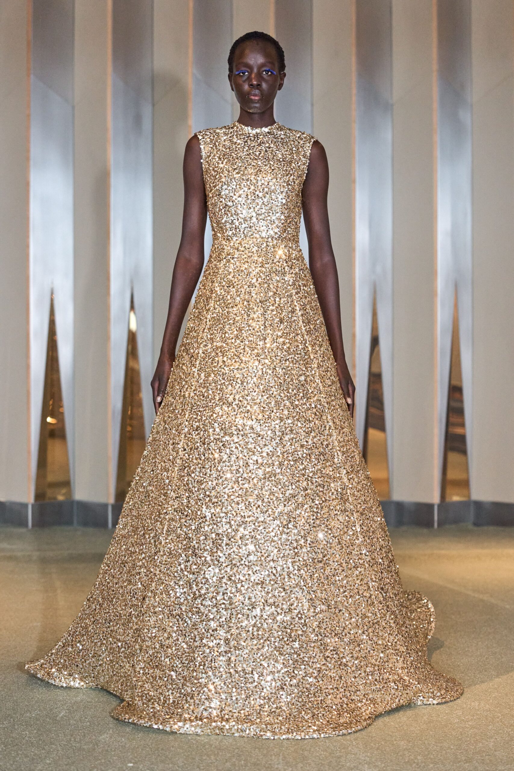 gold sequin sleeveless gown