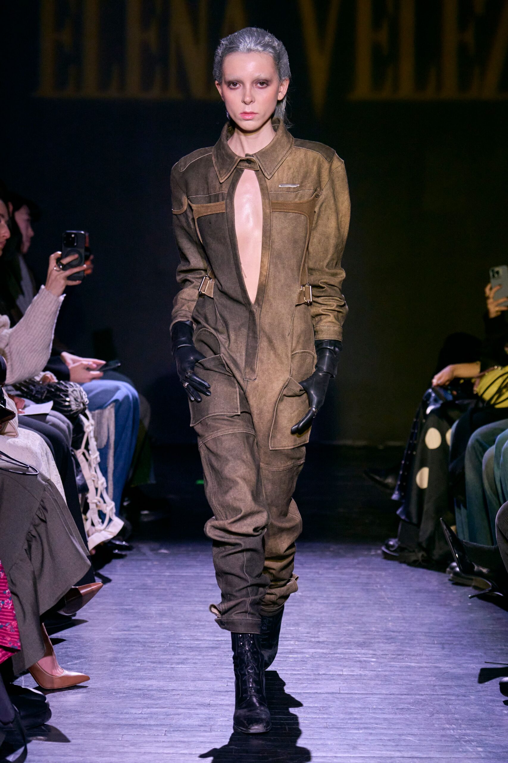 brown fitted jumpsuit with gloves and boots