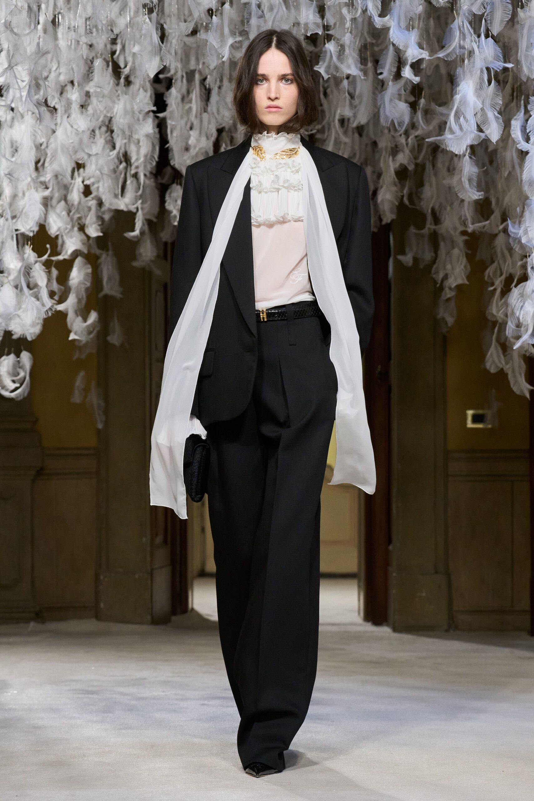 black tailored blazer white ruffled shirt