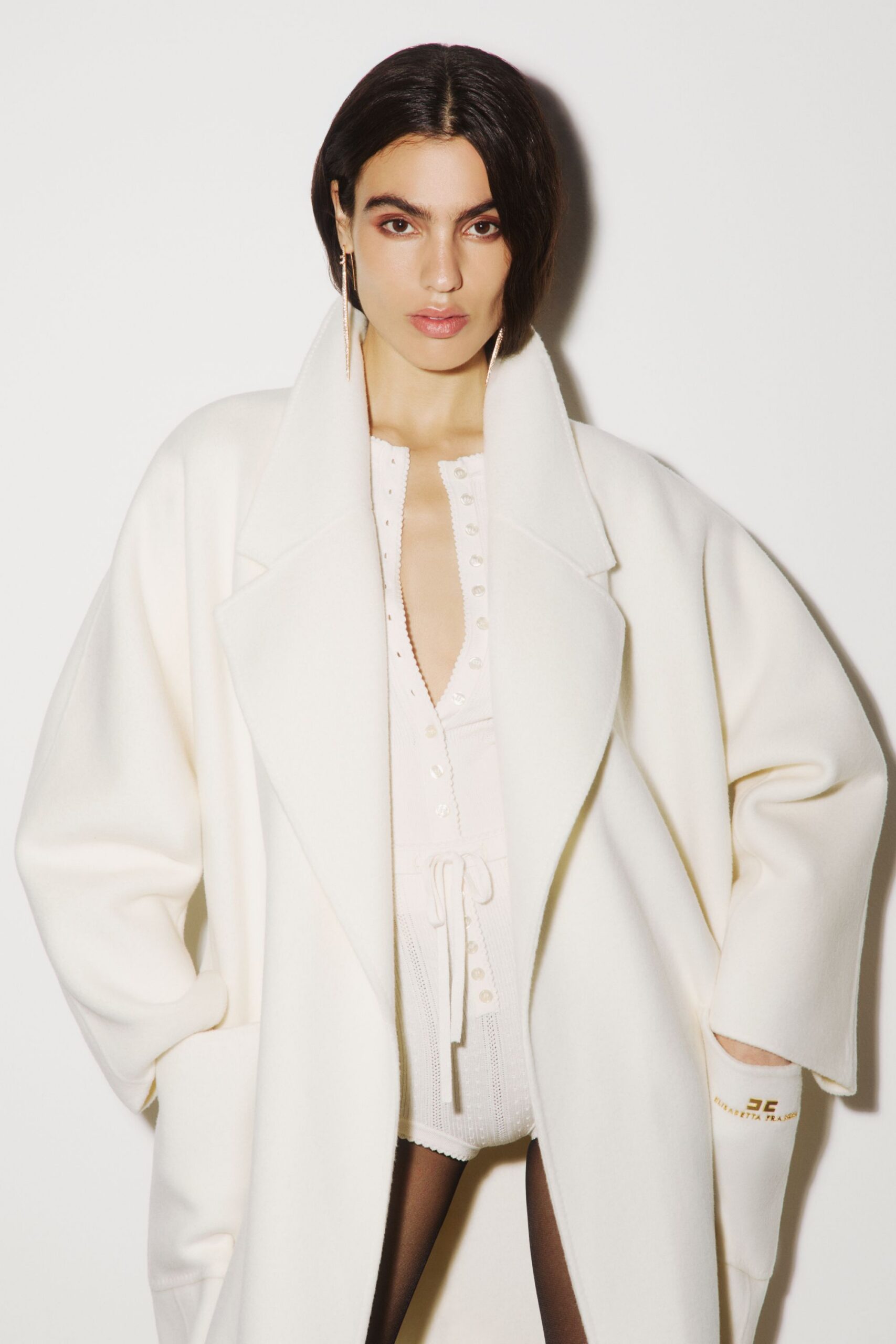 white wool long-sleeve collared oversized pockets coat