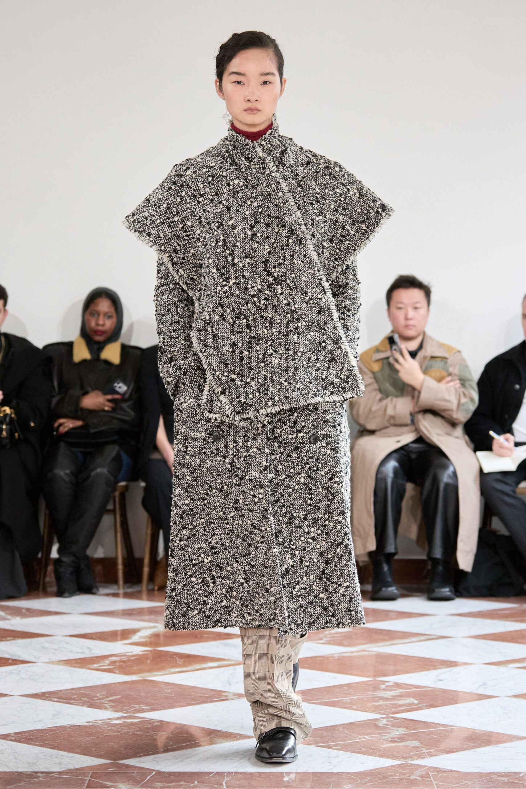black wool long-sleeve collared relaxed layered textured coat