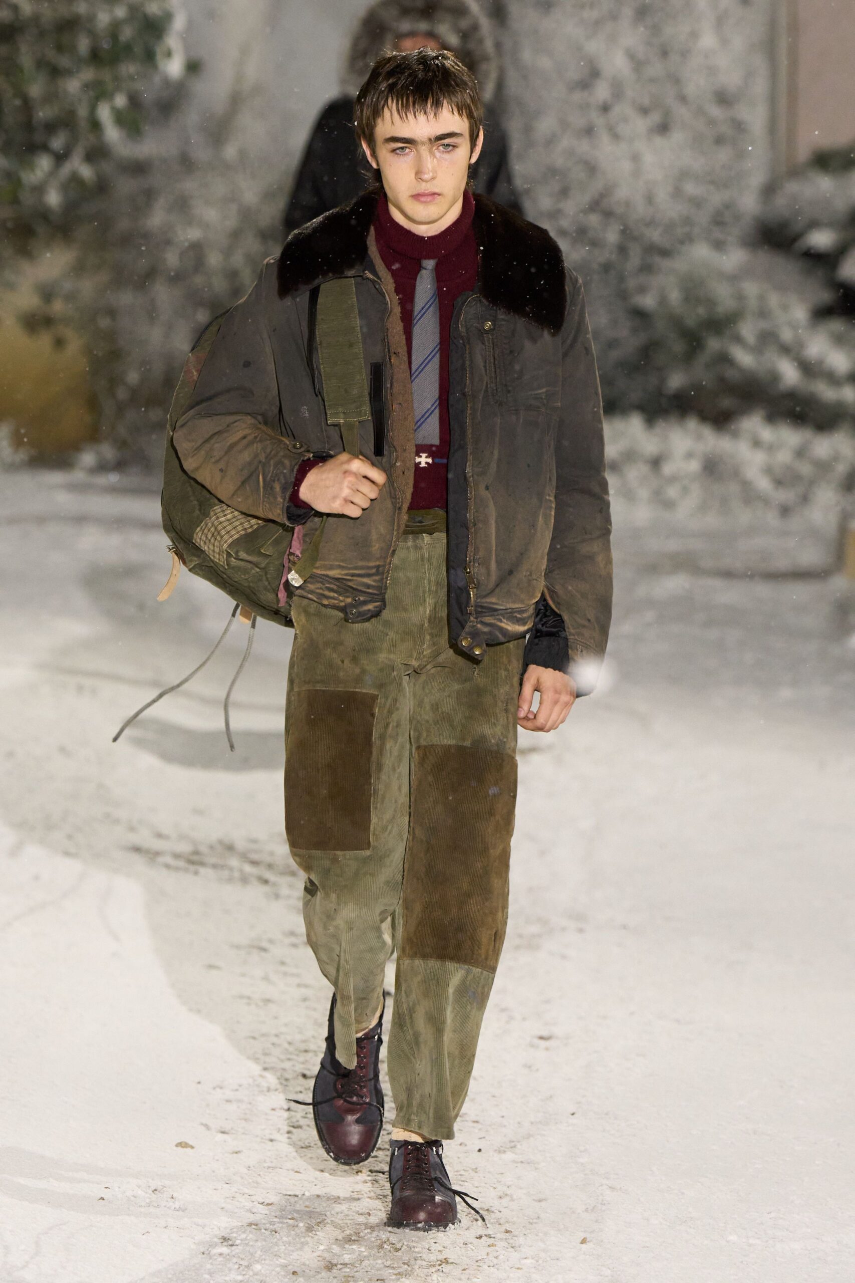 brown leather jacket with green pants