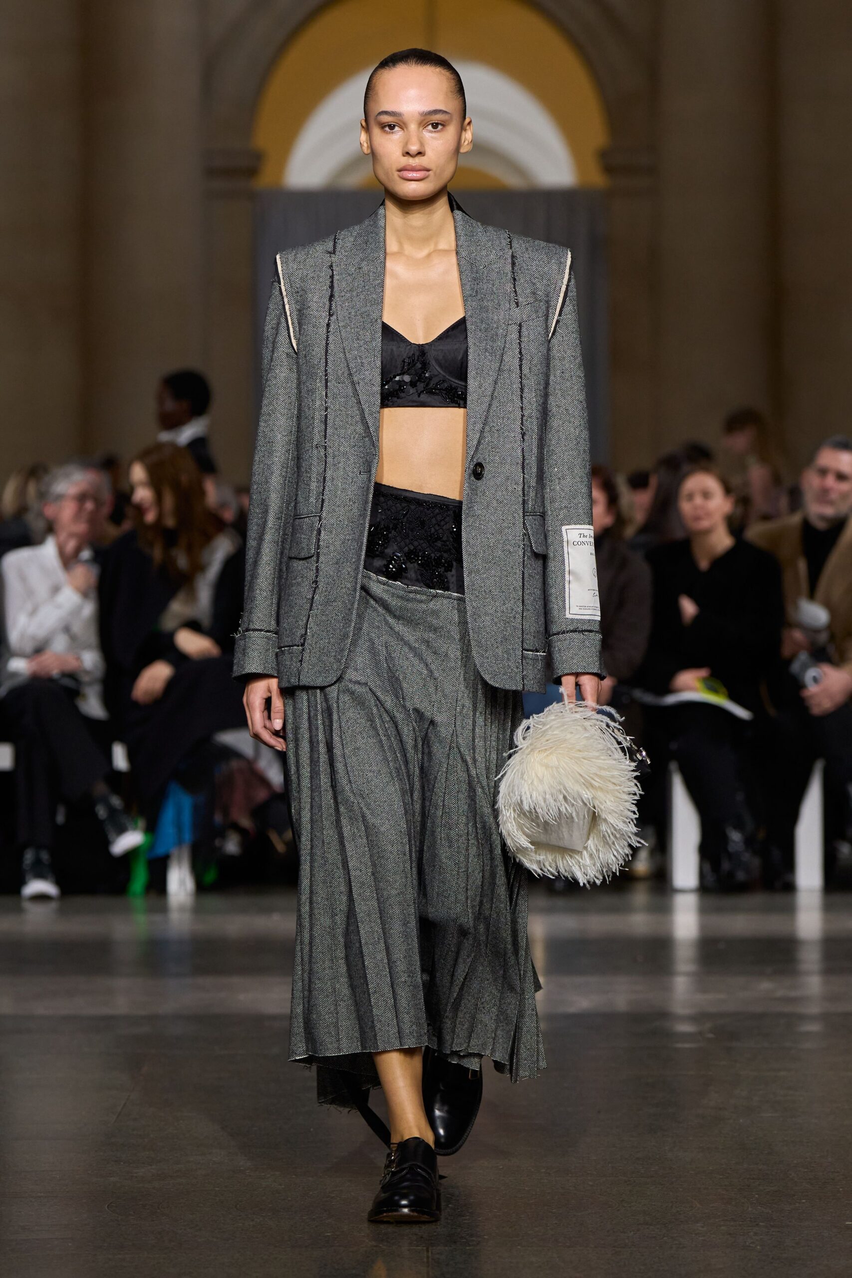 gray tailored blazer with pleated skirt