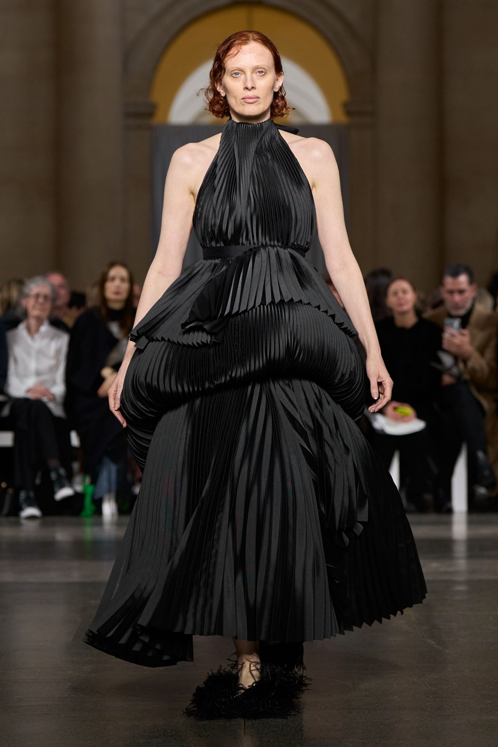 black silk sleeveless high-neck fitted pleated flowing gown