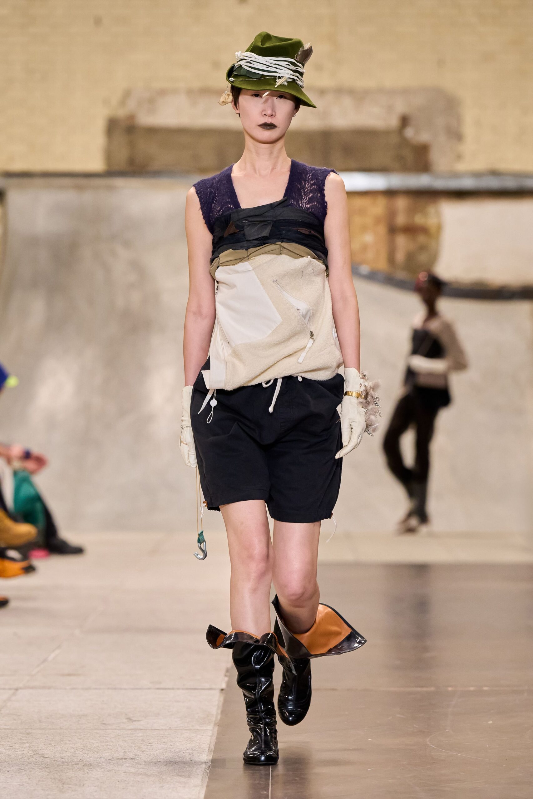 beige layered sleeveless top with black shorts