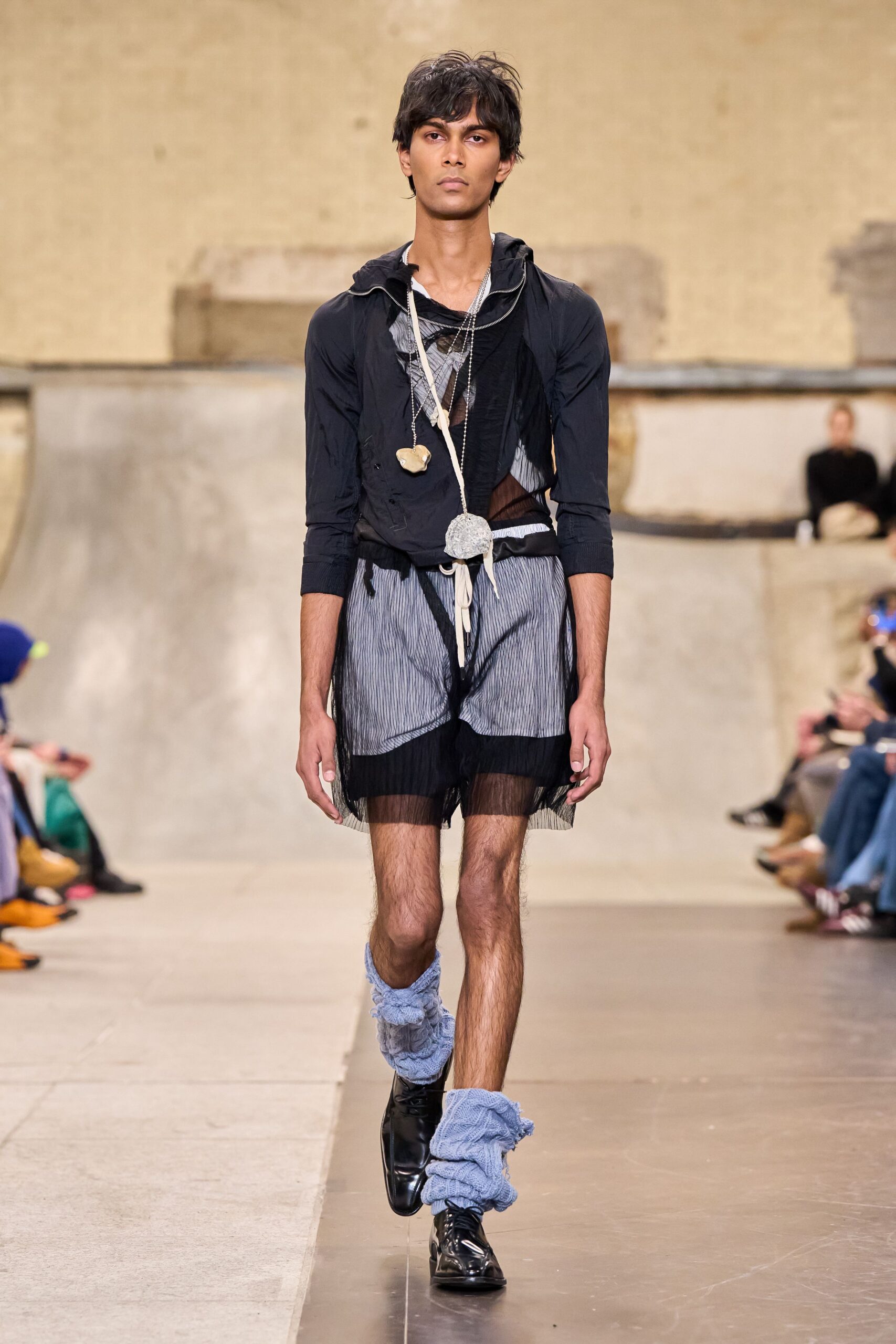 black fitted hooded top with denim shorts