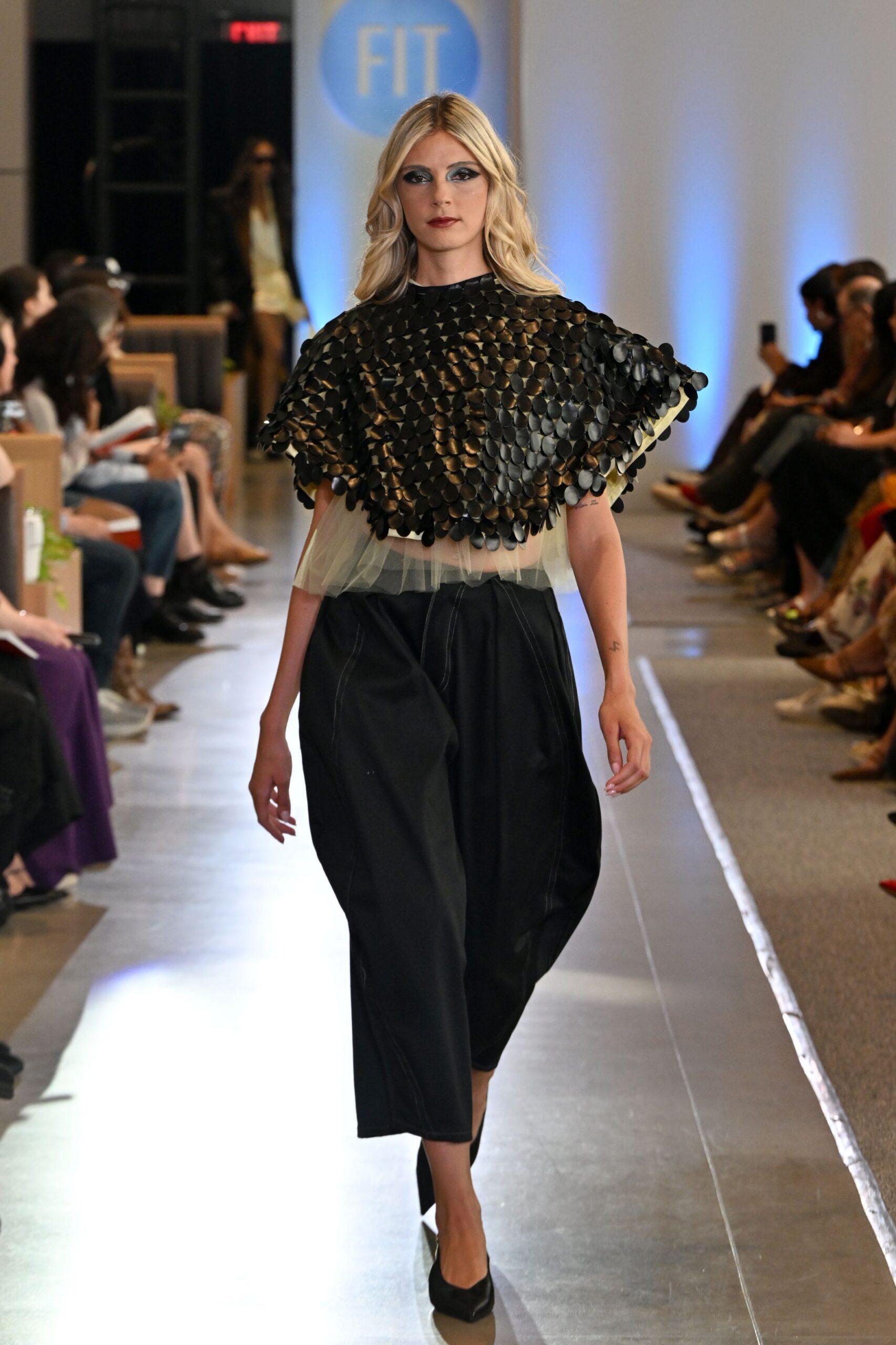 black layered top with wide-leg pants