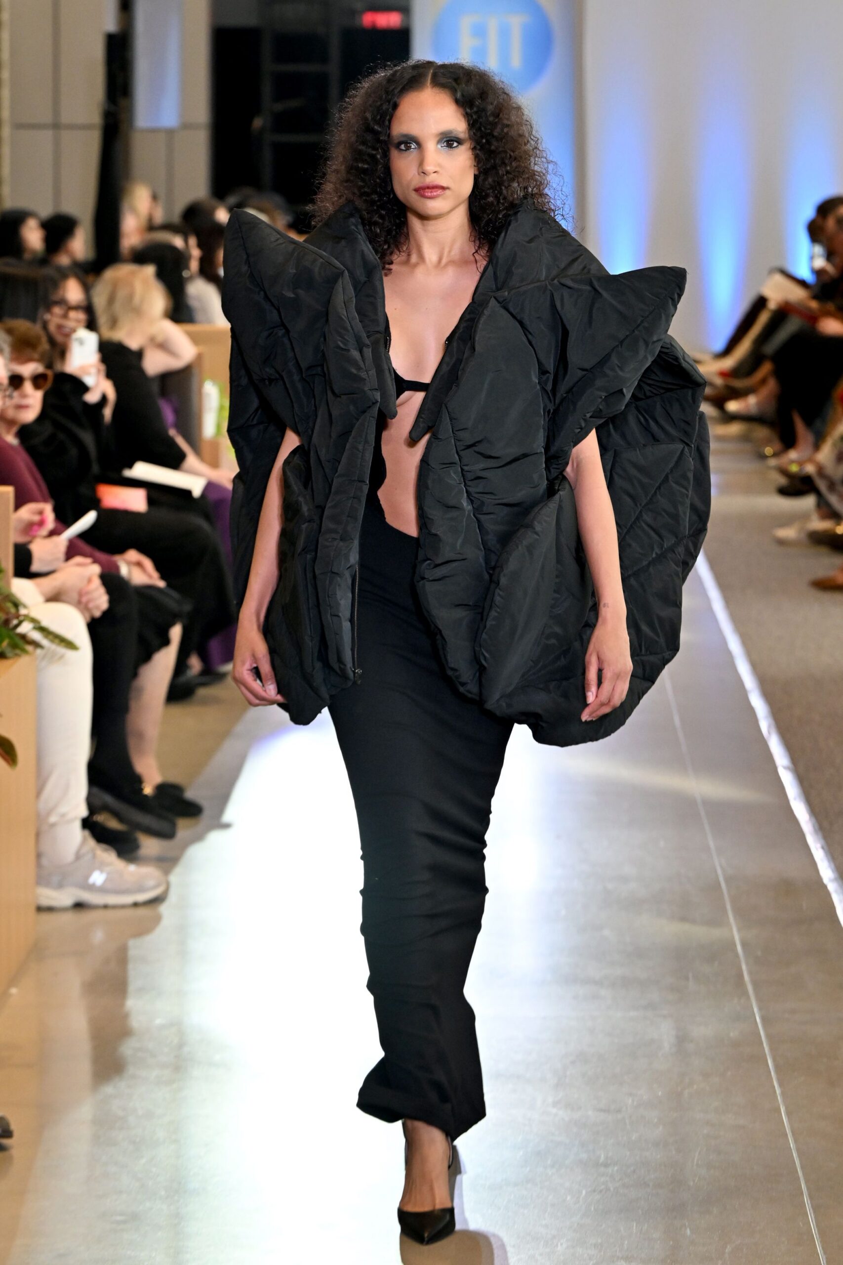 black padded coat with fitted pants