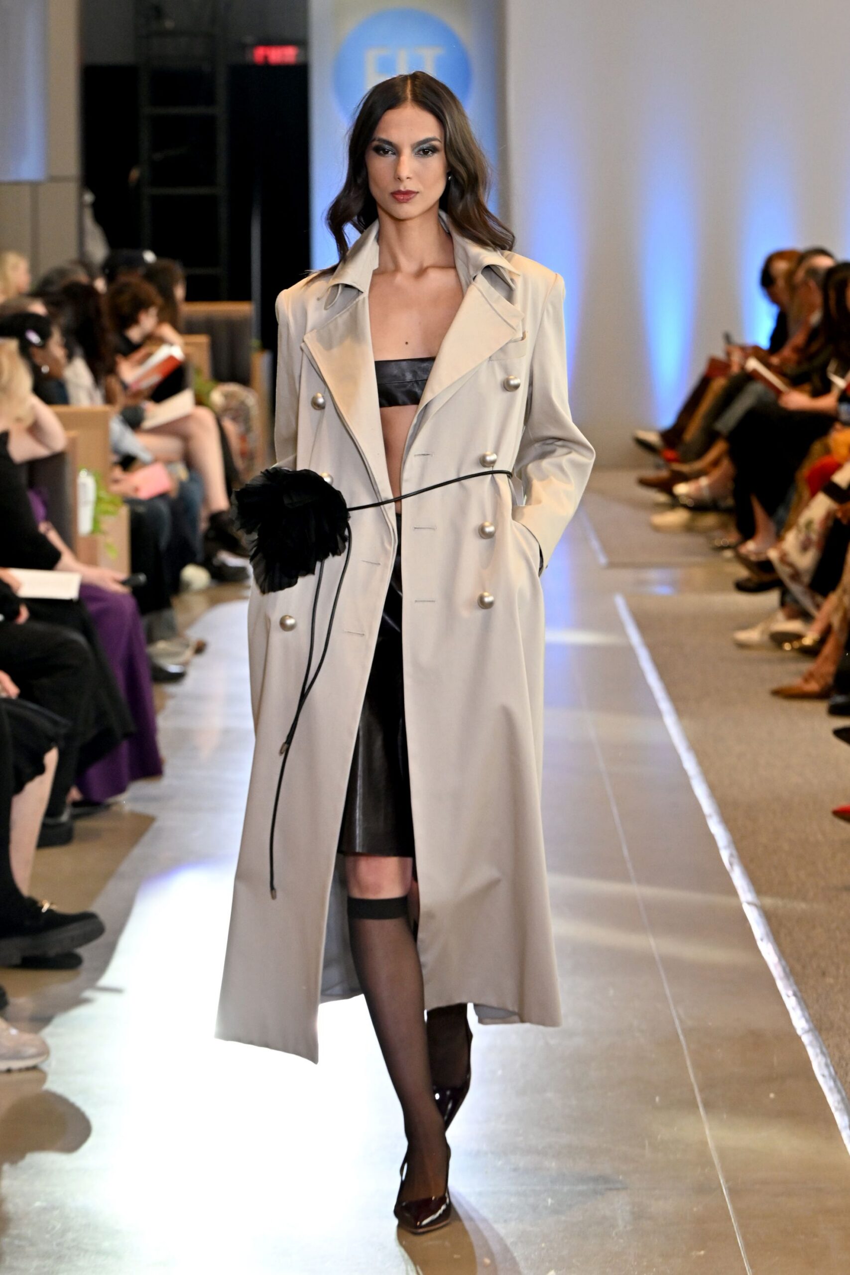 beige trench coat with black leather top